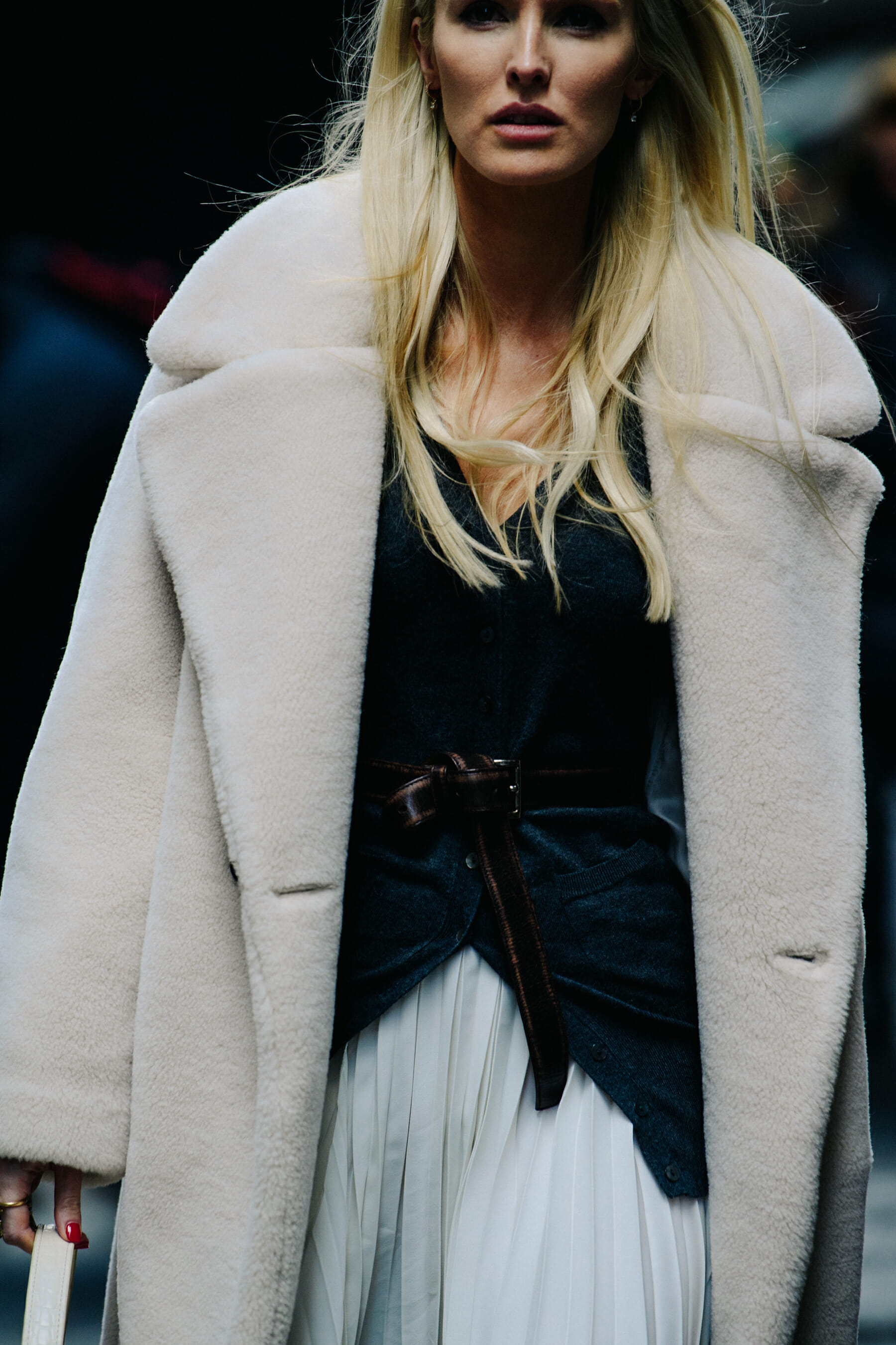 Woman wearing white fur coat