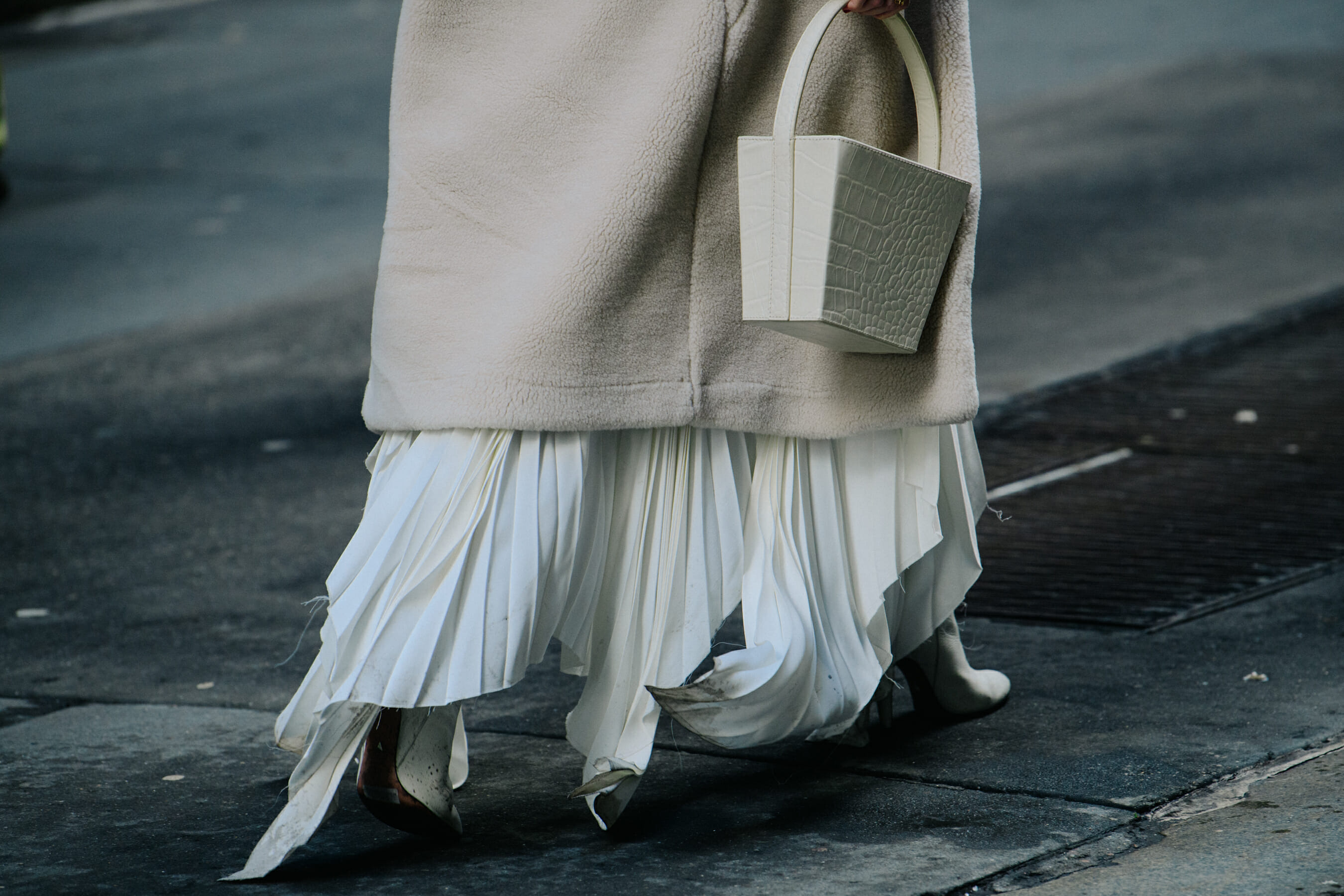 Woman carrying white bag