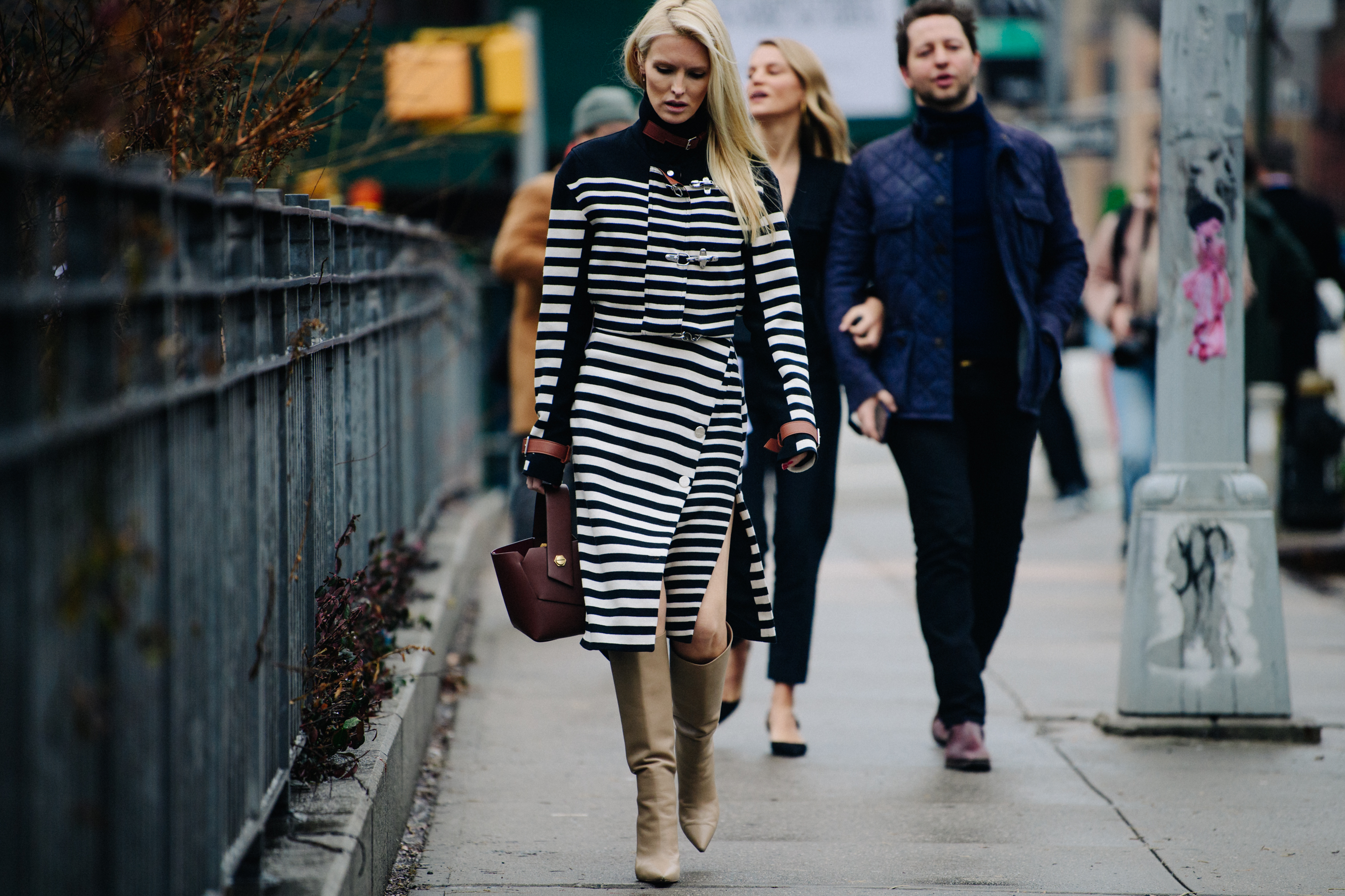 Woman wearing striped coat