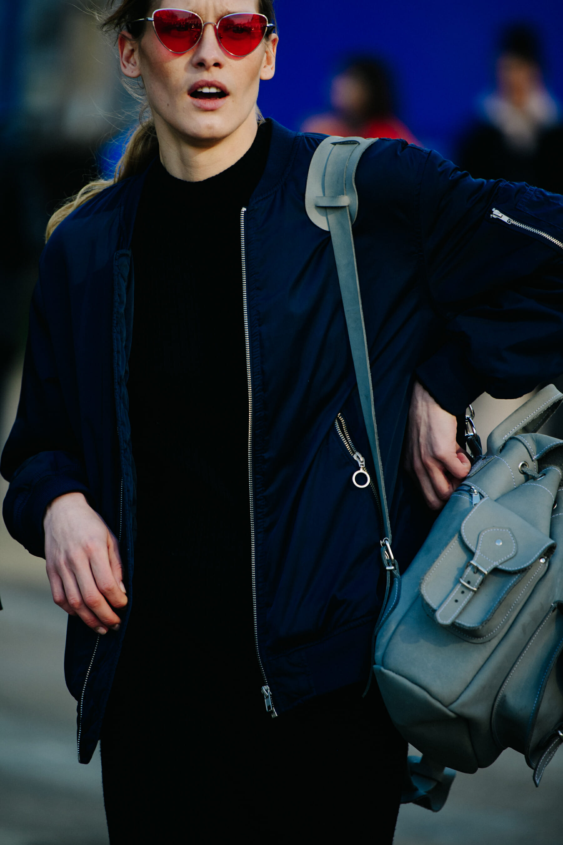 Model wearing orange sunglasses