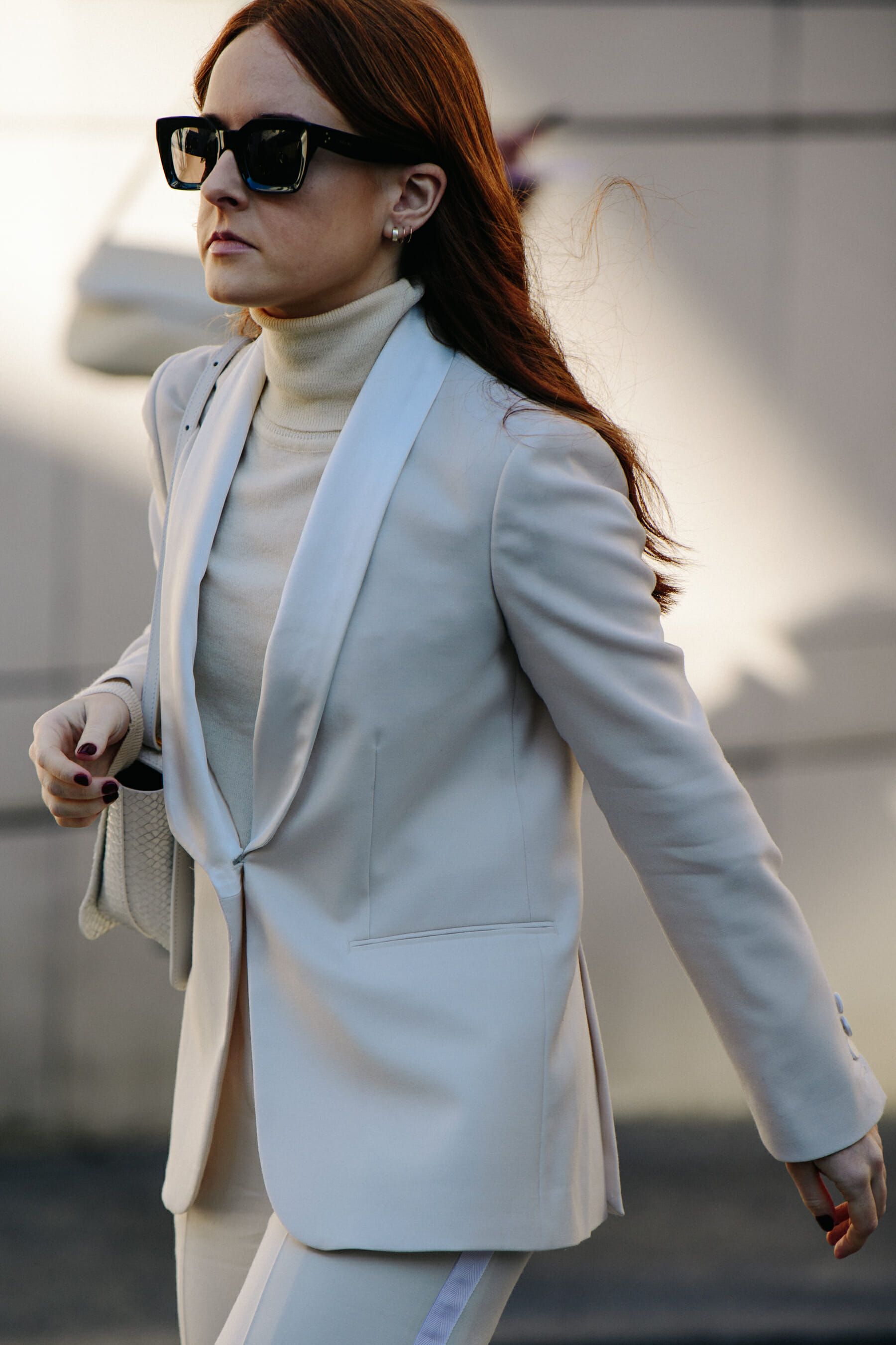 Woman wearing white suit