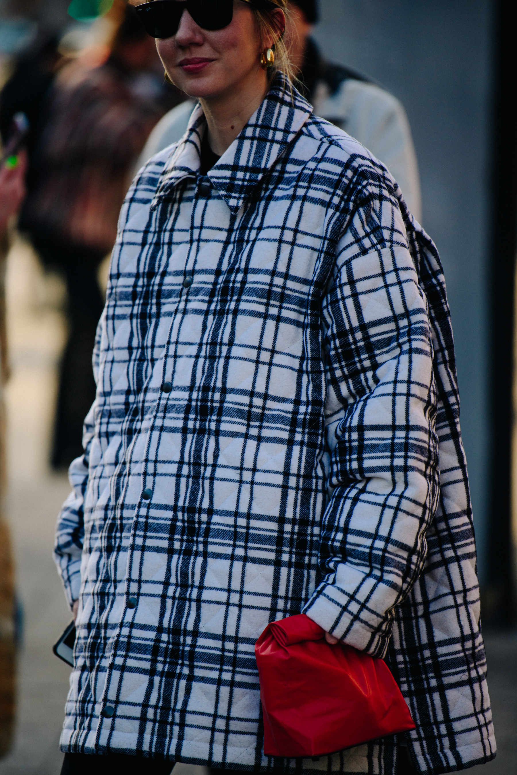 Woman carrying small red bag