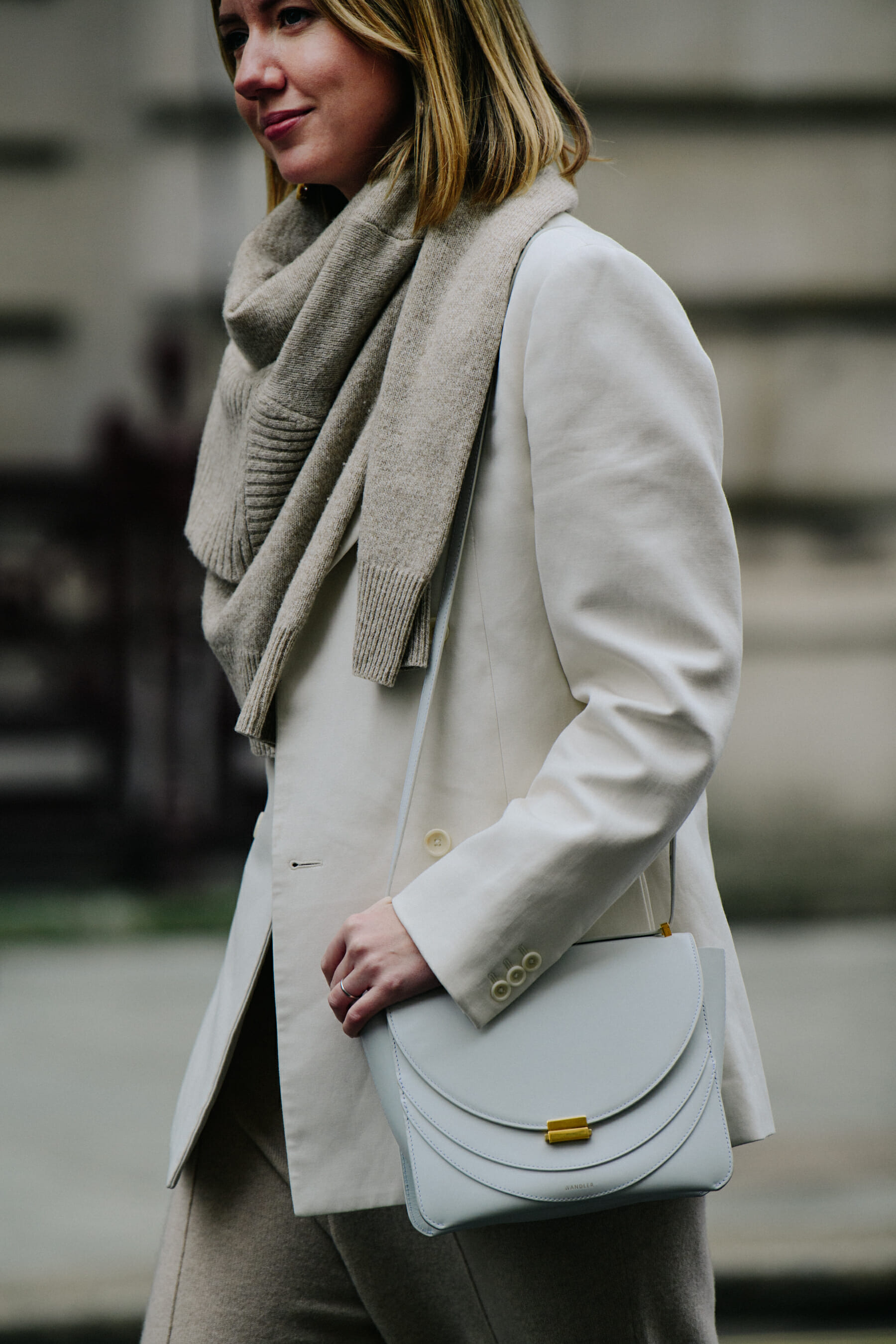 Buyer wearing white suit jacket