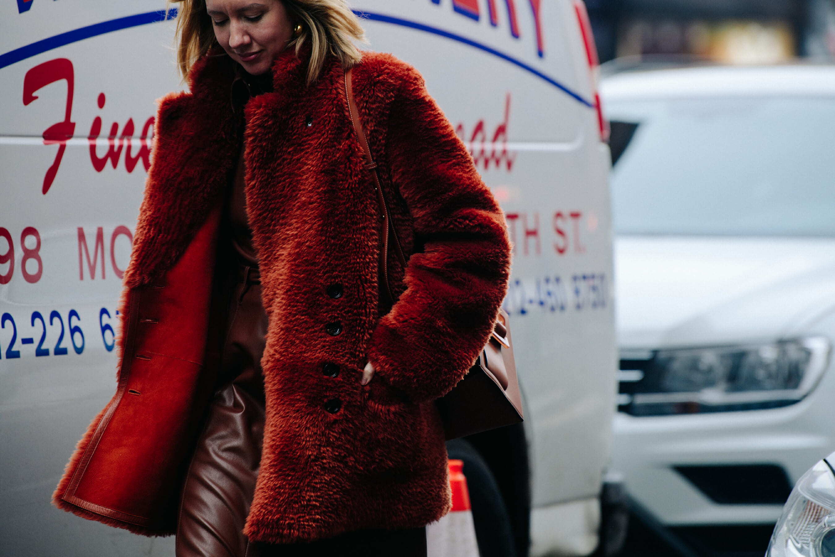 Woman wearing red fur jacket