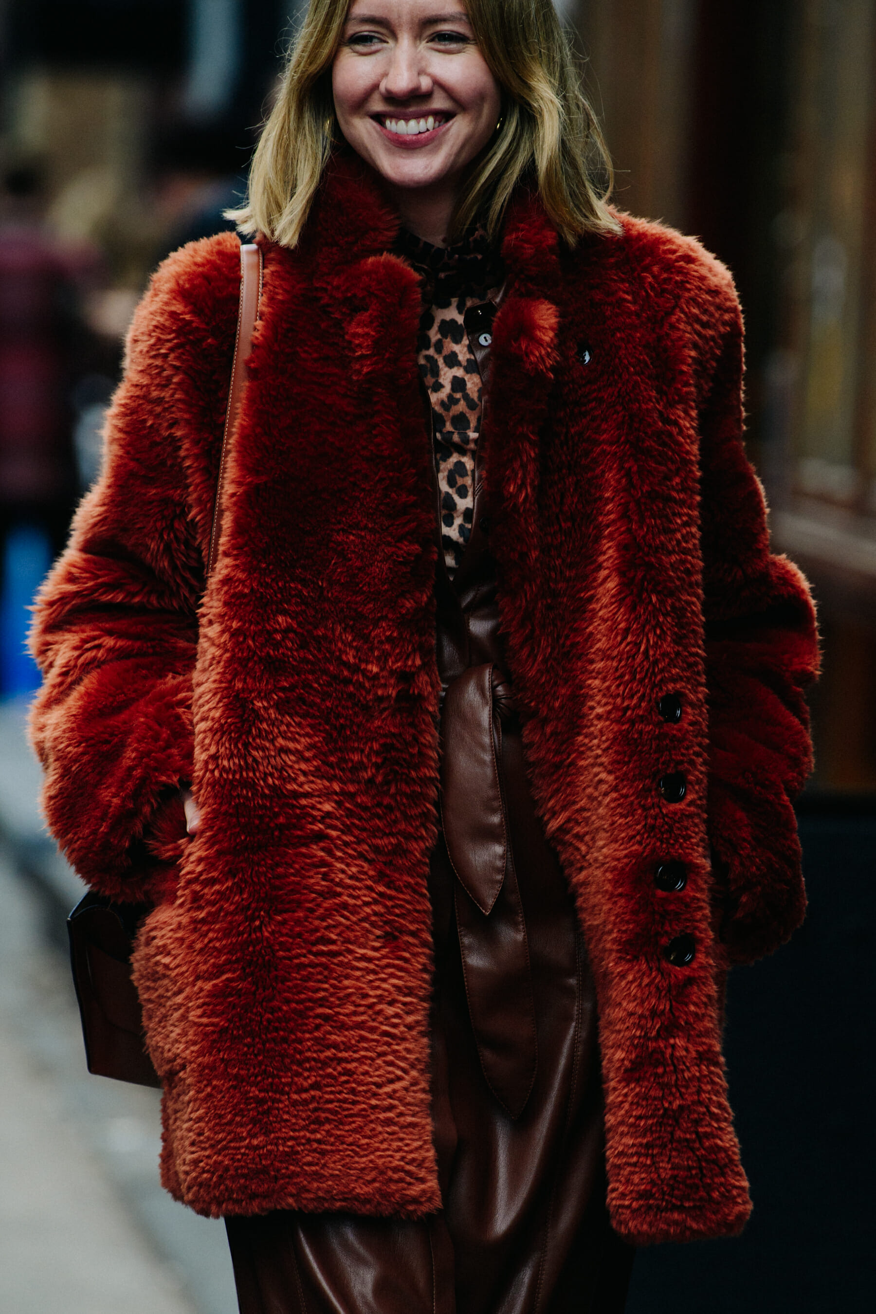 Woman wearing red fur jacket
