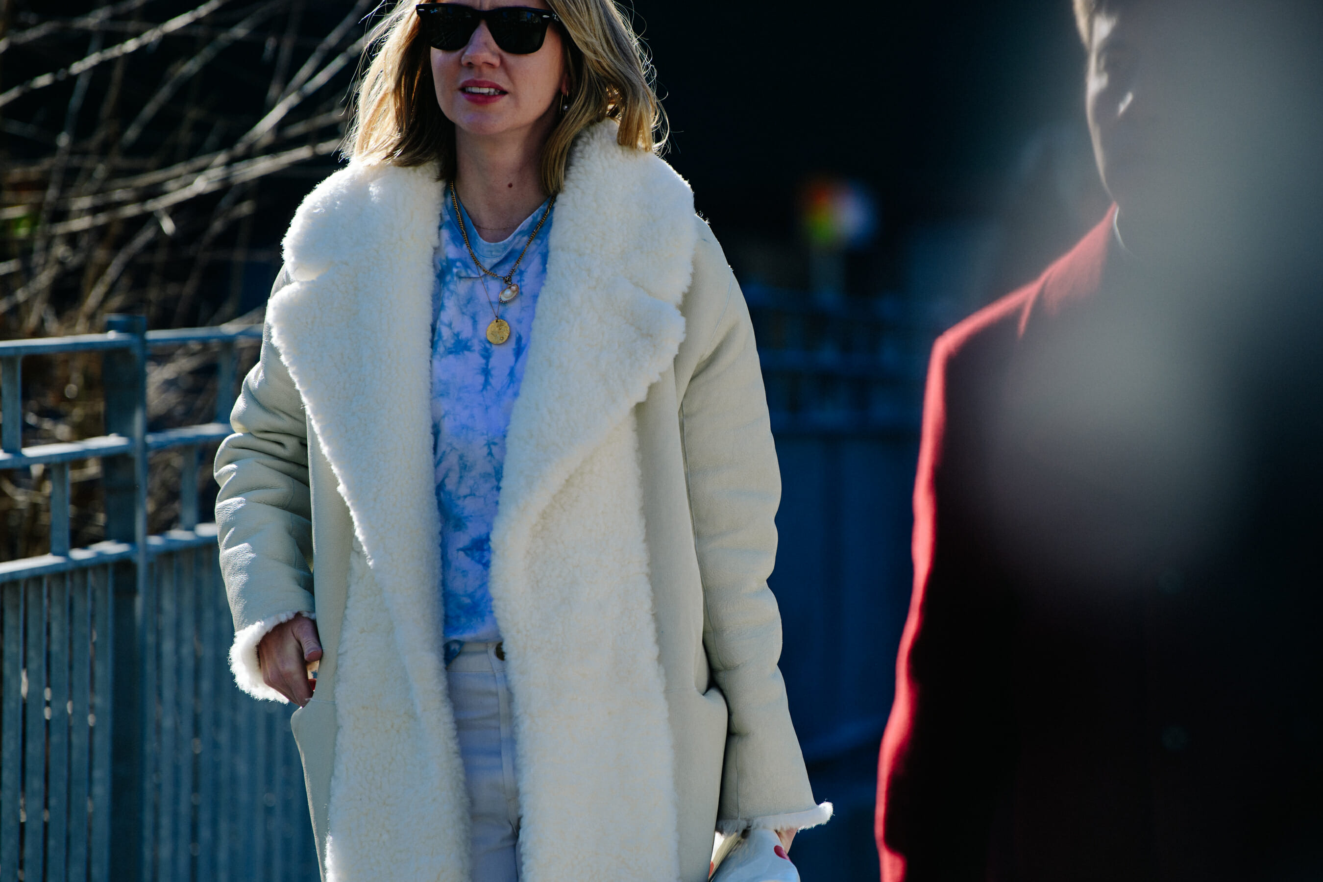 Woman wearing white fur coat