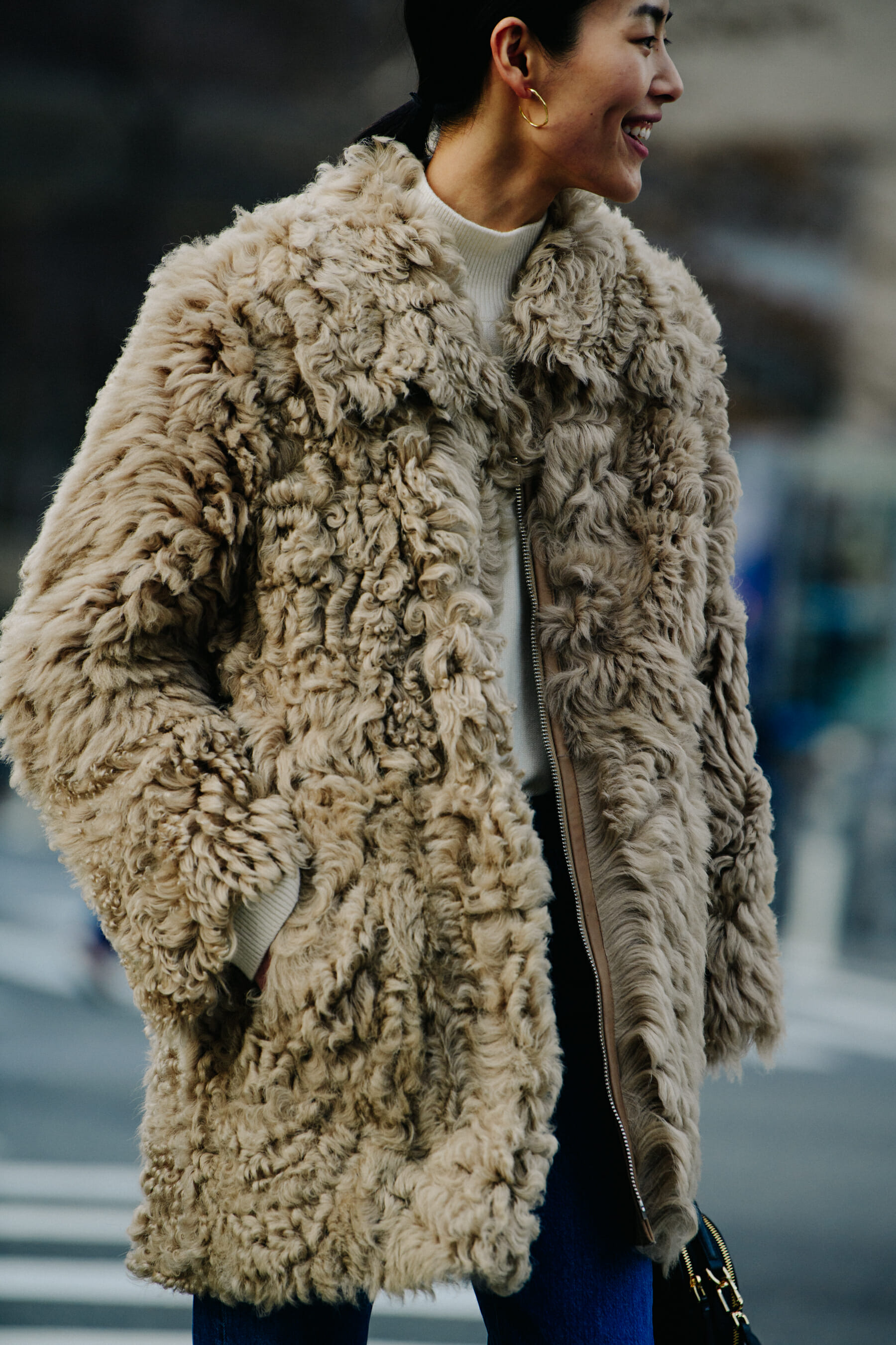 Model wearing sheep wool jacket