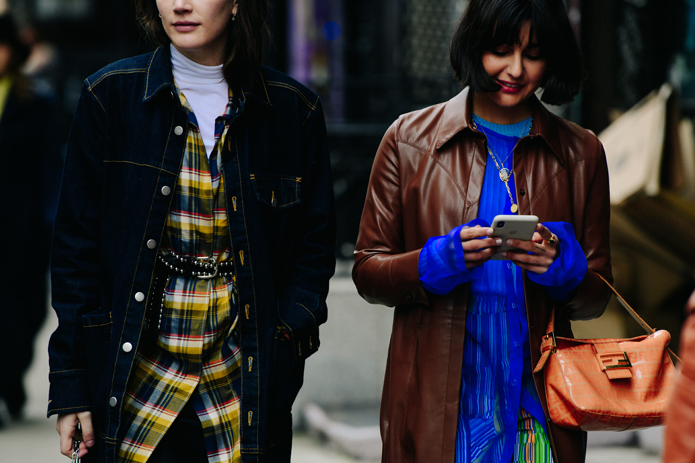 Two women wearing colourful tops