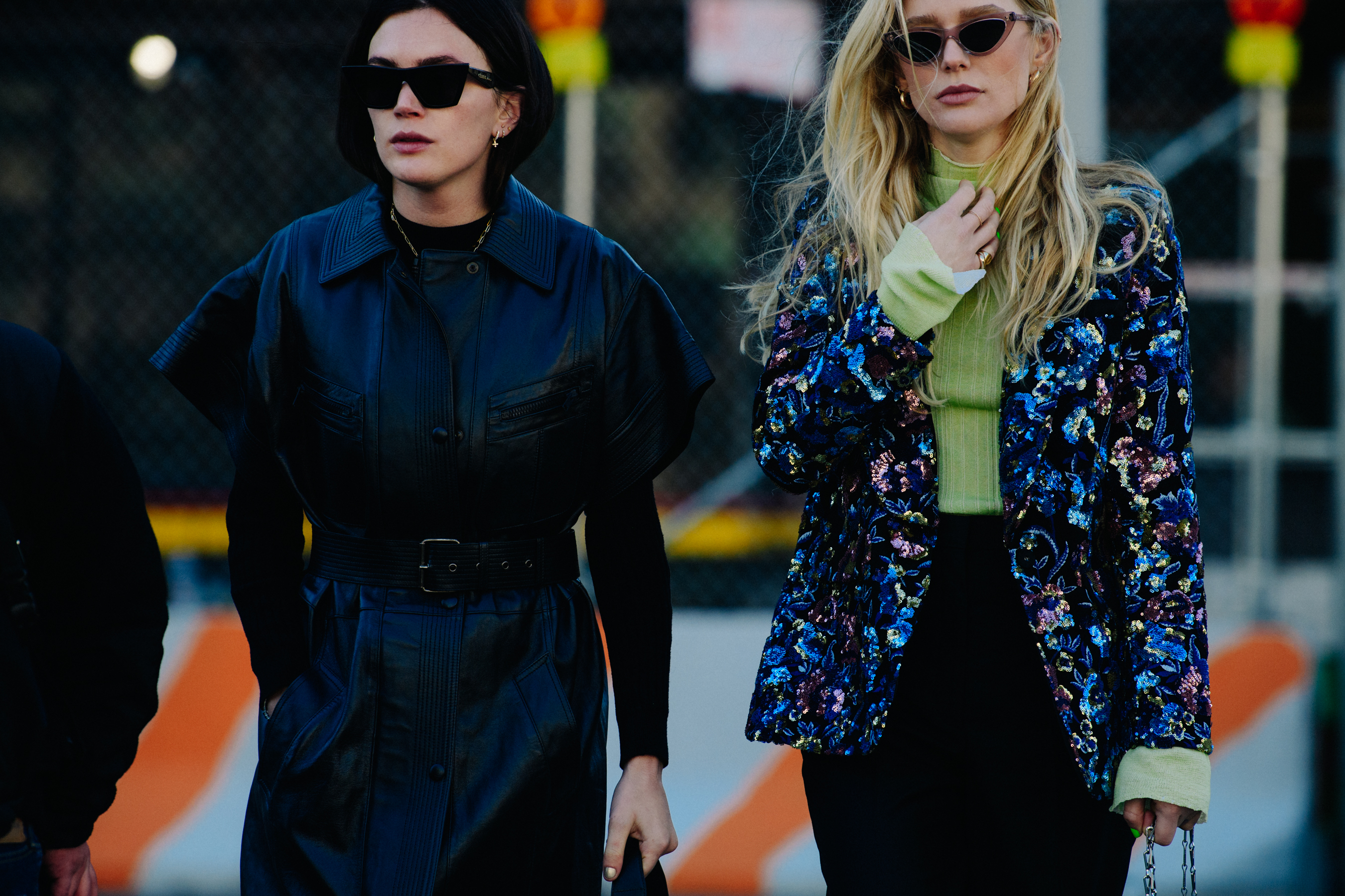 Two bloggers wearing dark coats