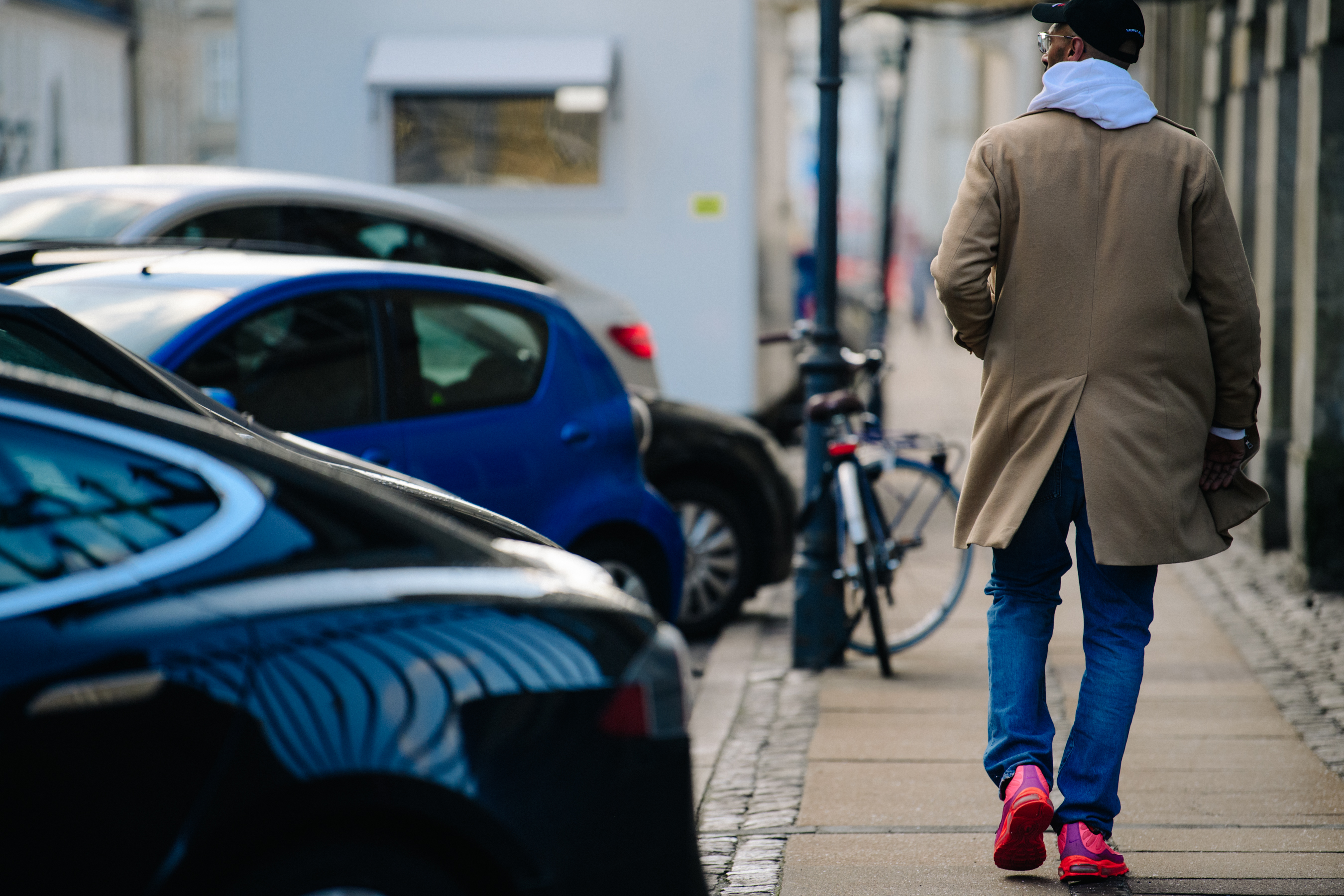 Man wearing pink sneakers