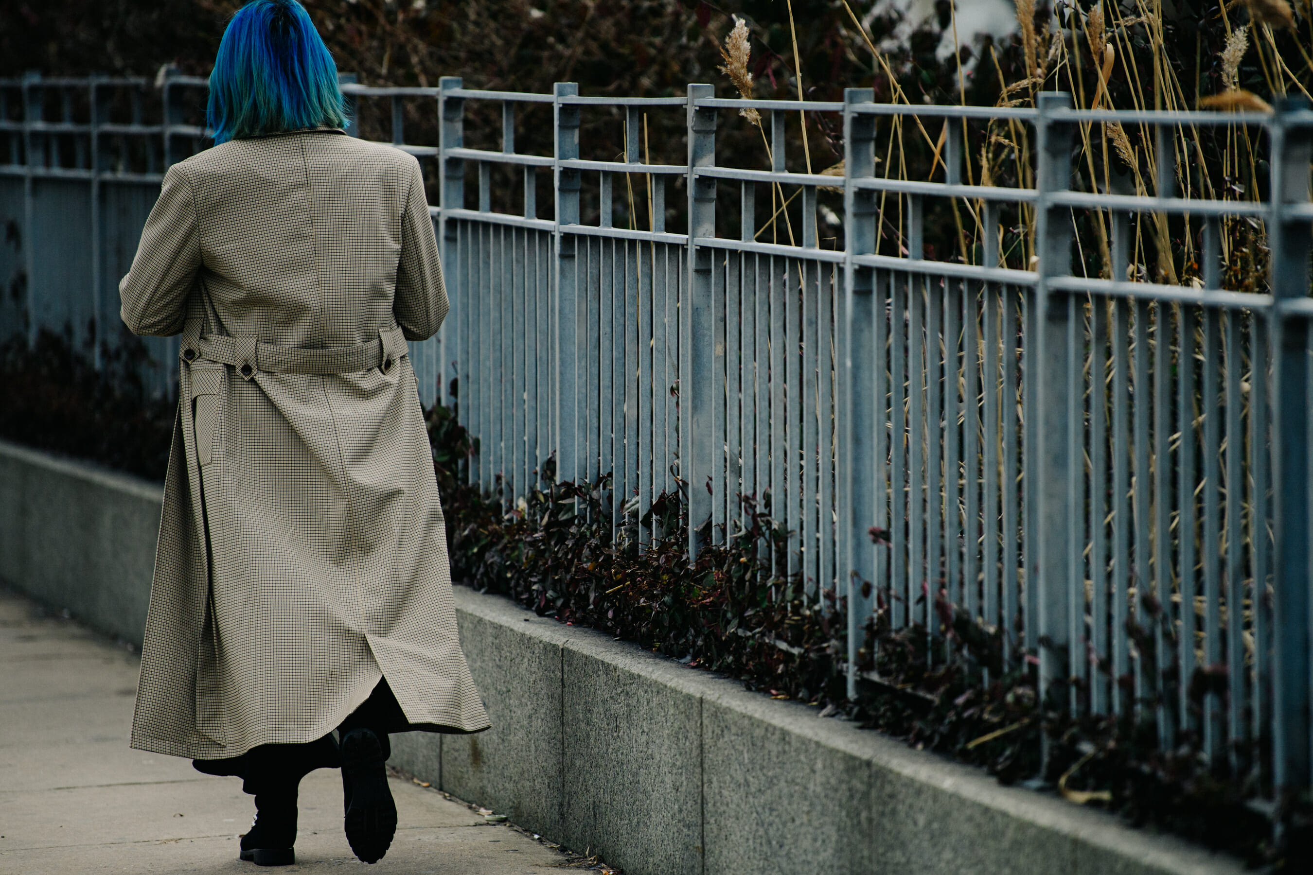 Woman wearing long check coat