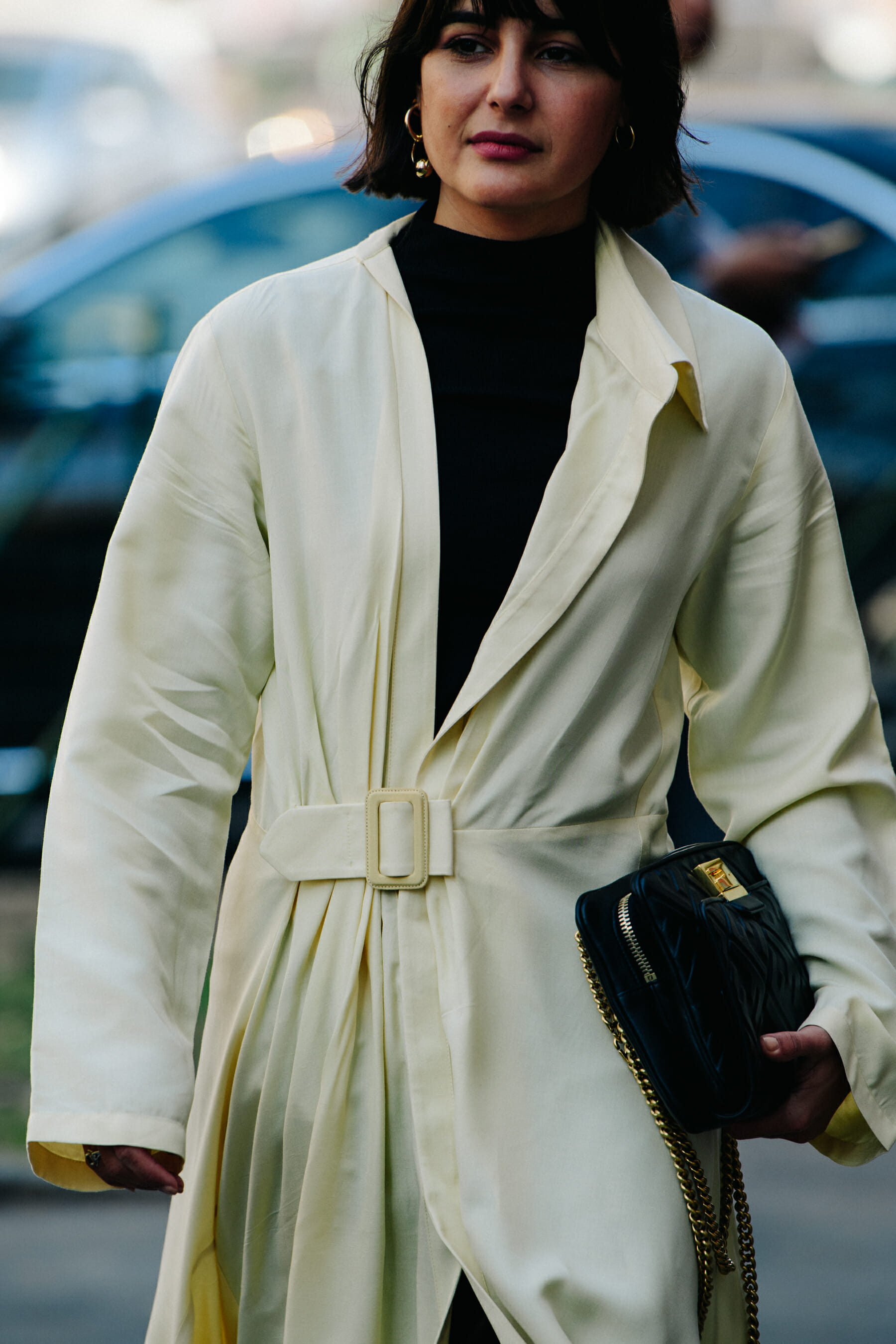 Woman wearing long yellow jacket