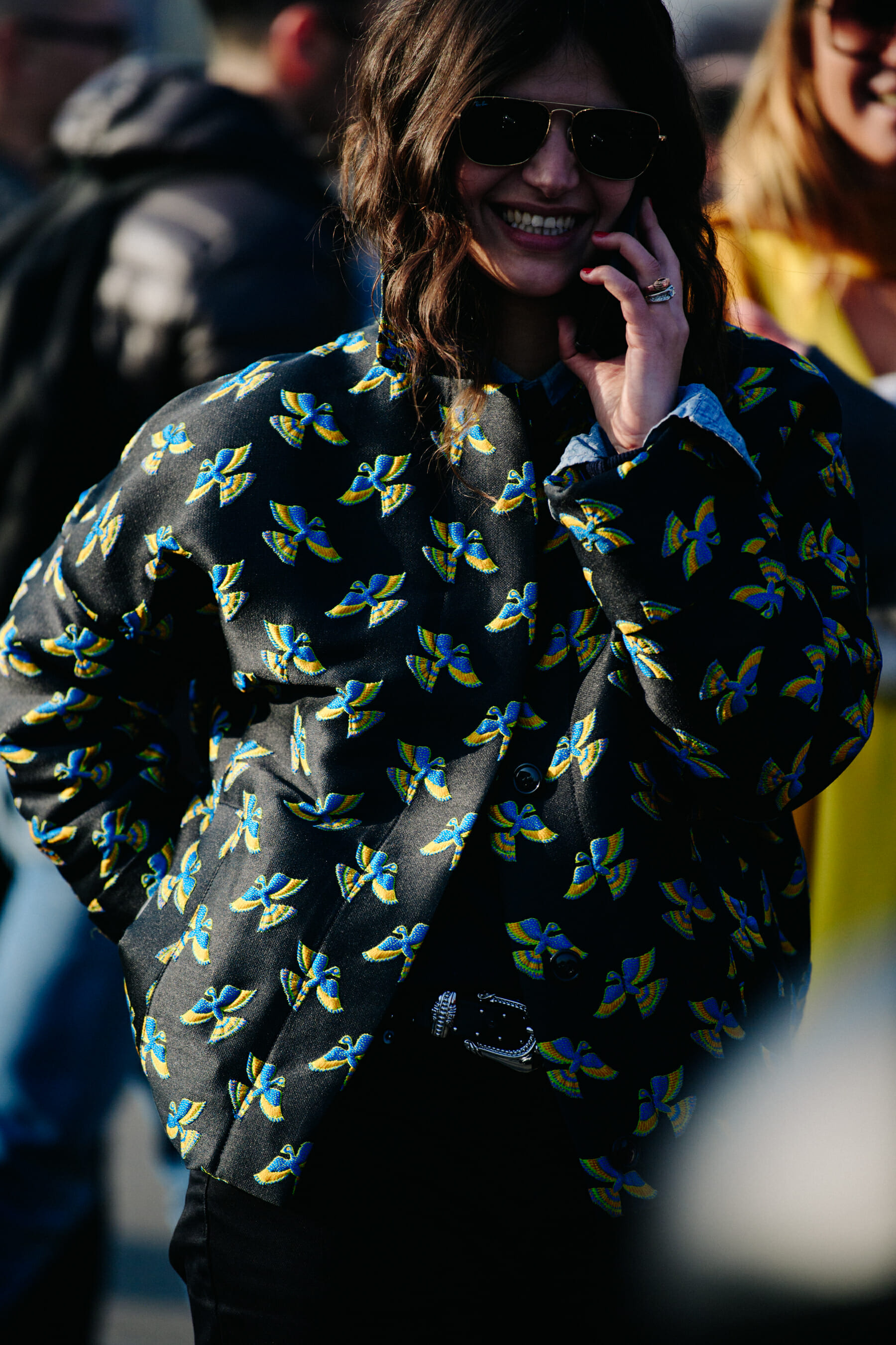 Woman wearing bird pattern jacket
