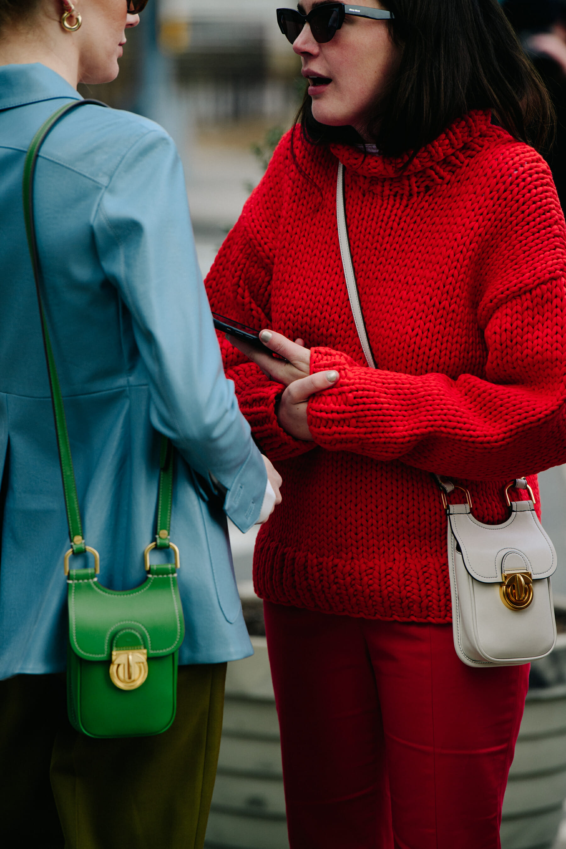 Two bloggers wearing small bags