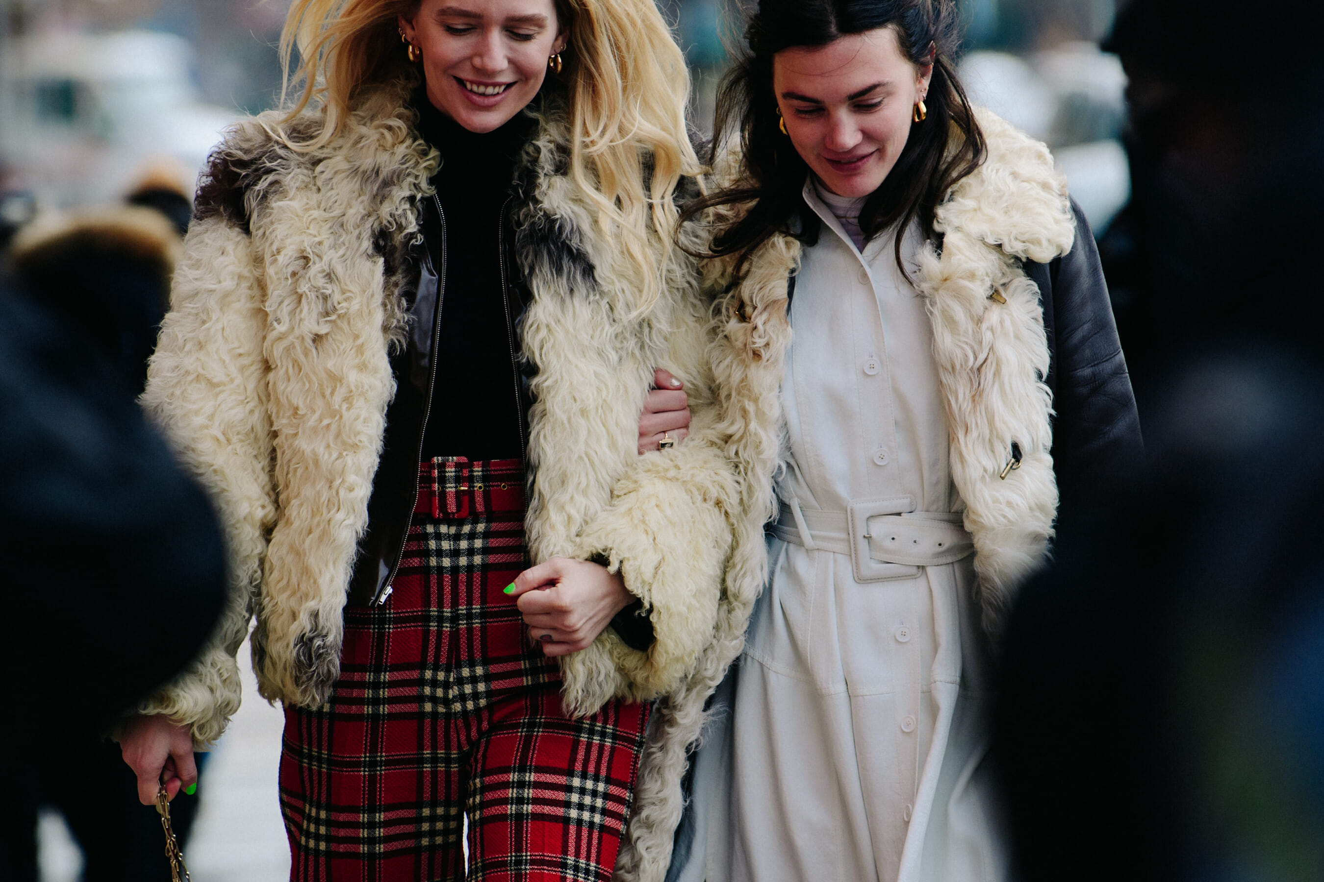 Two women wearing wool jackets