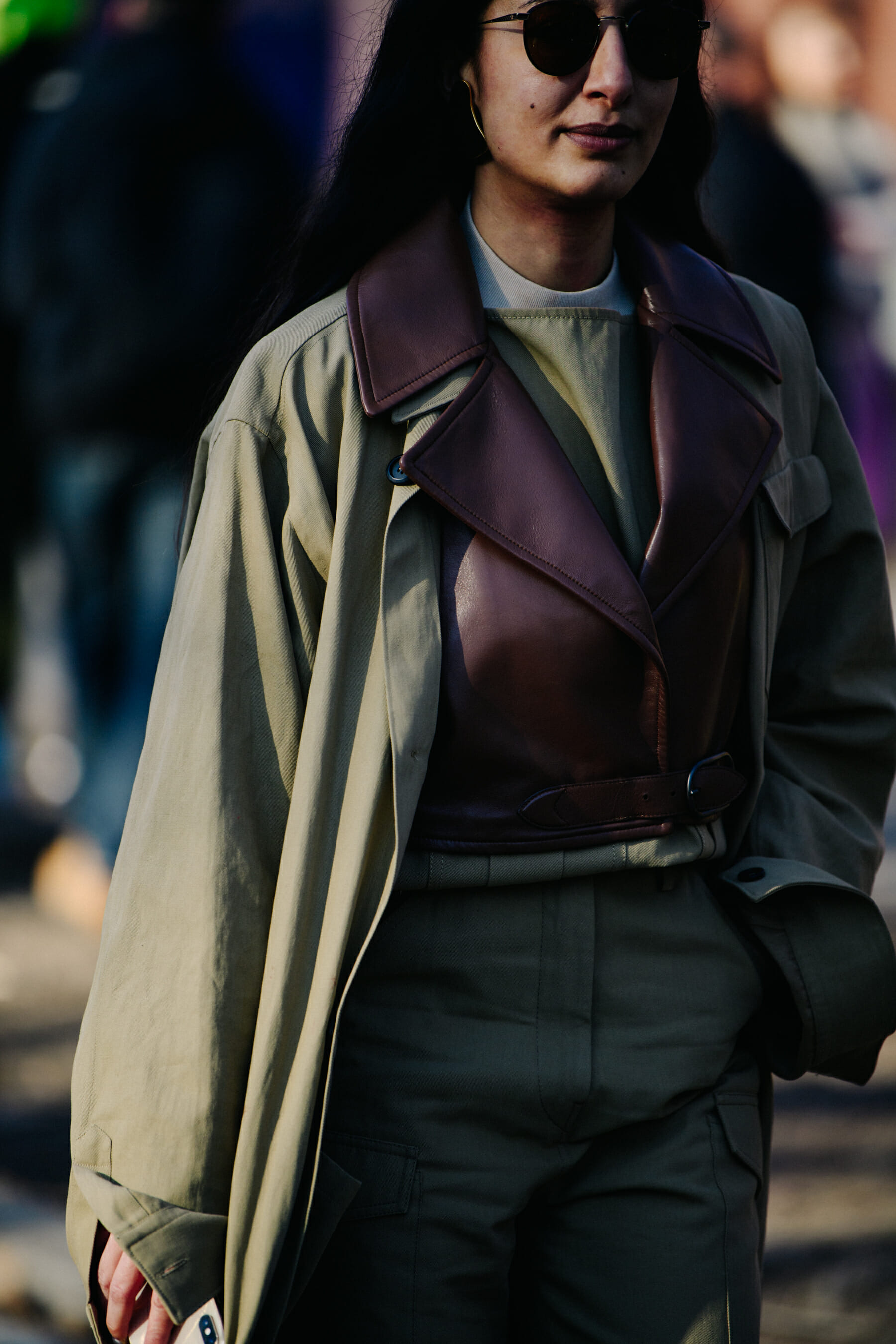 Woman wearing brown leather vest