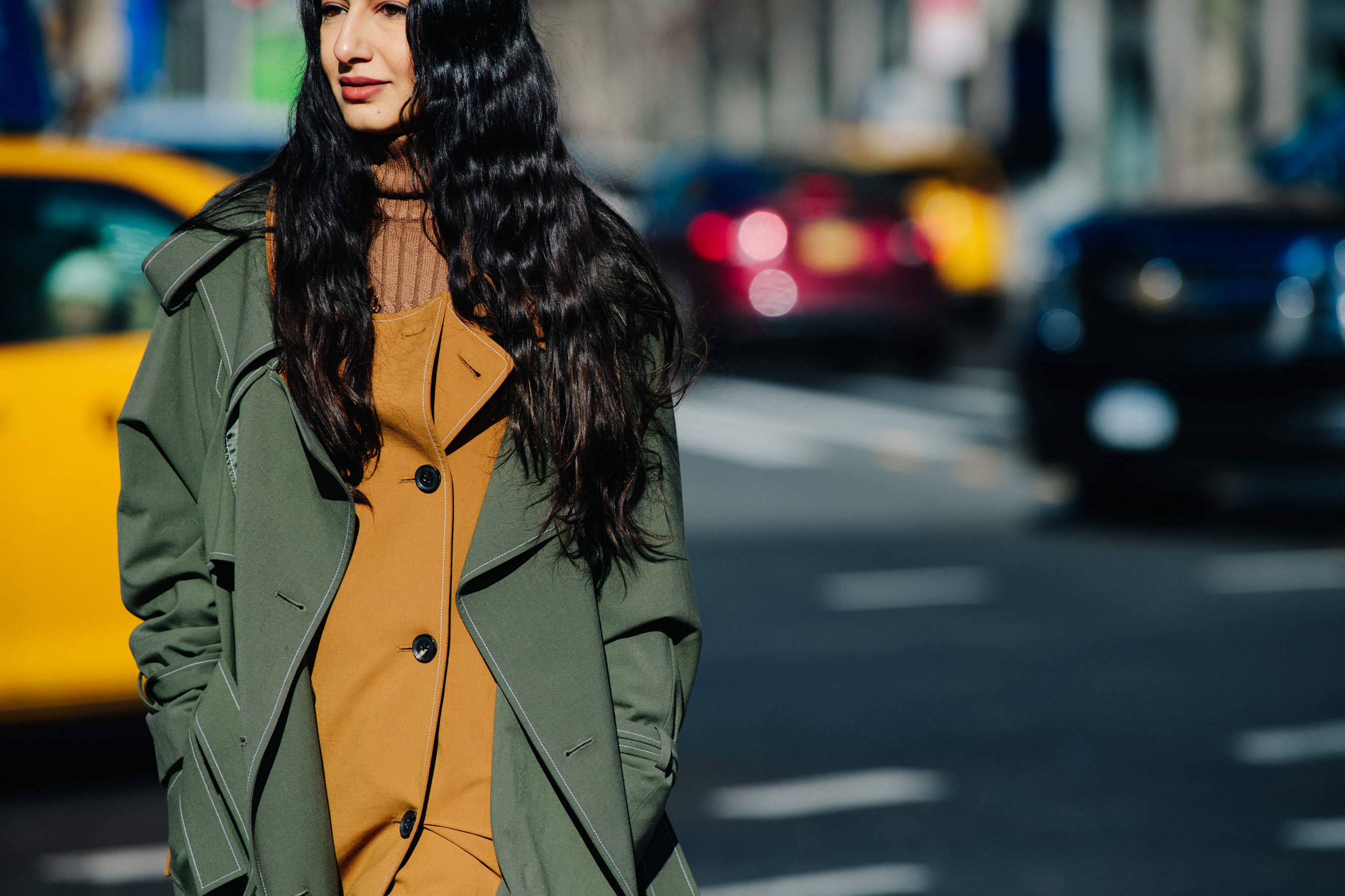 Woman wearing mustard and green