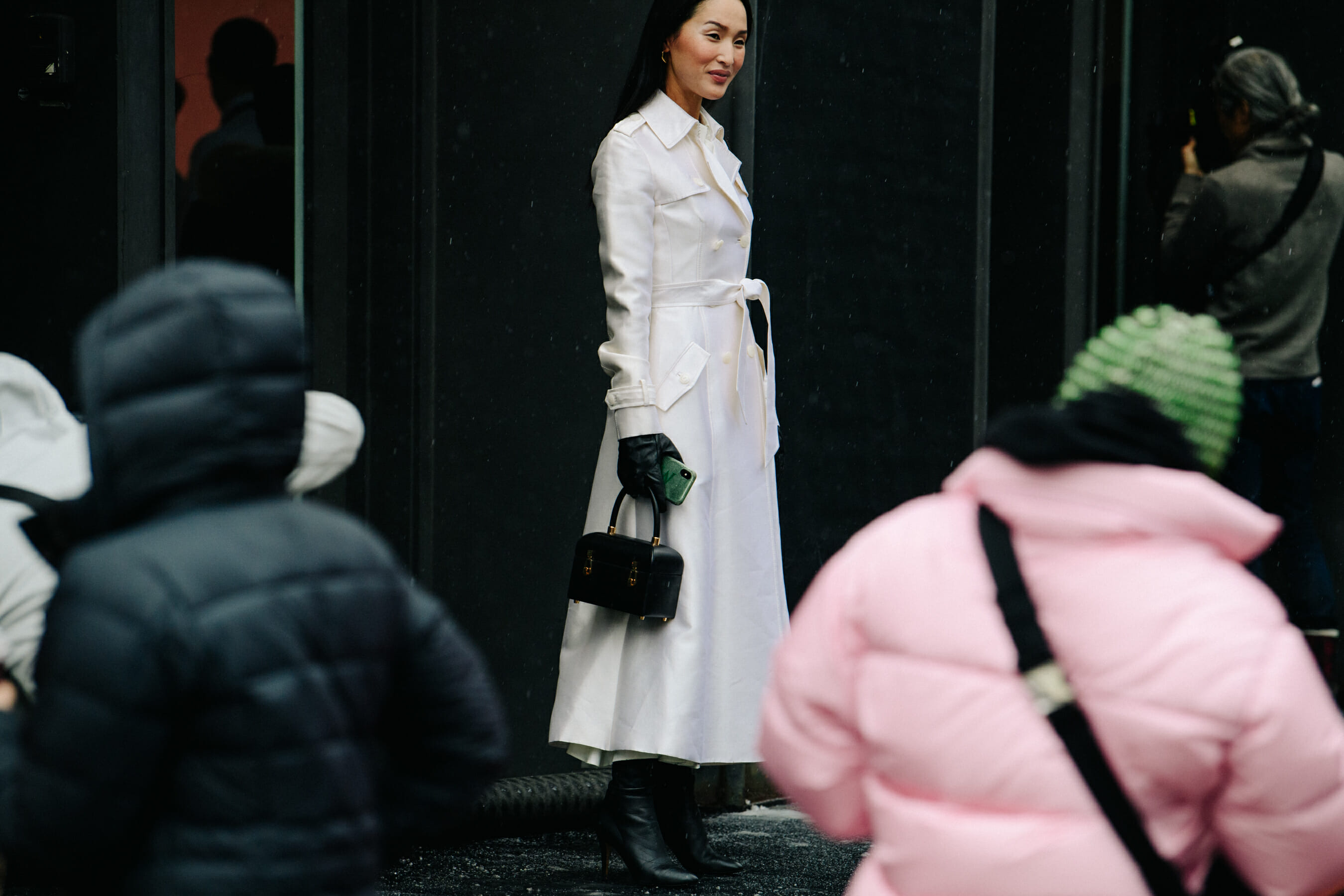 Woman wearing long white coat