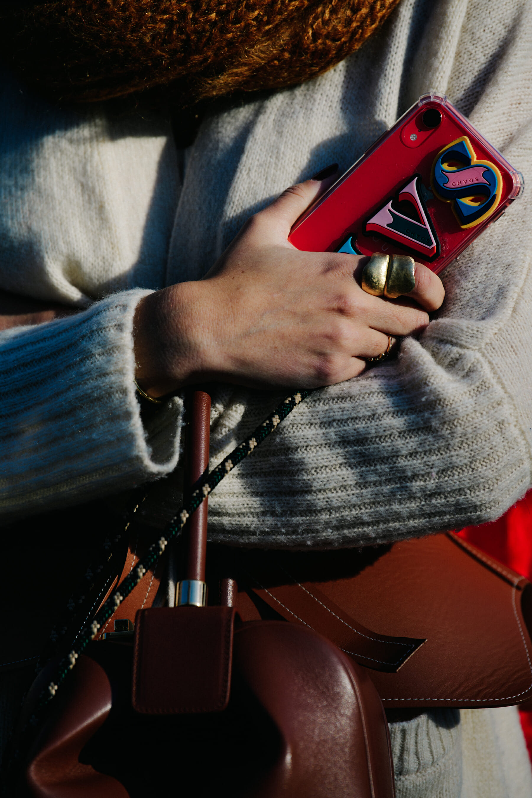 Woman carrying brown leather bag