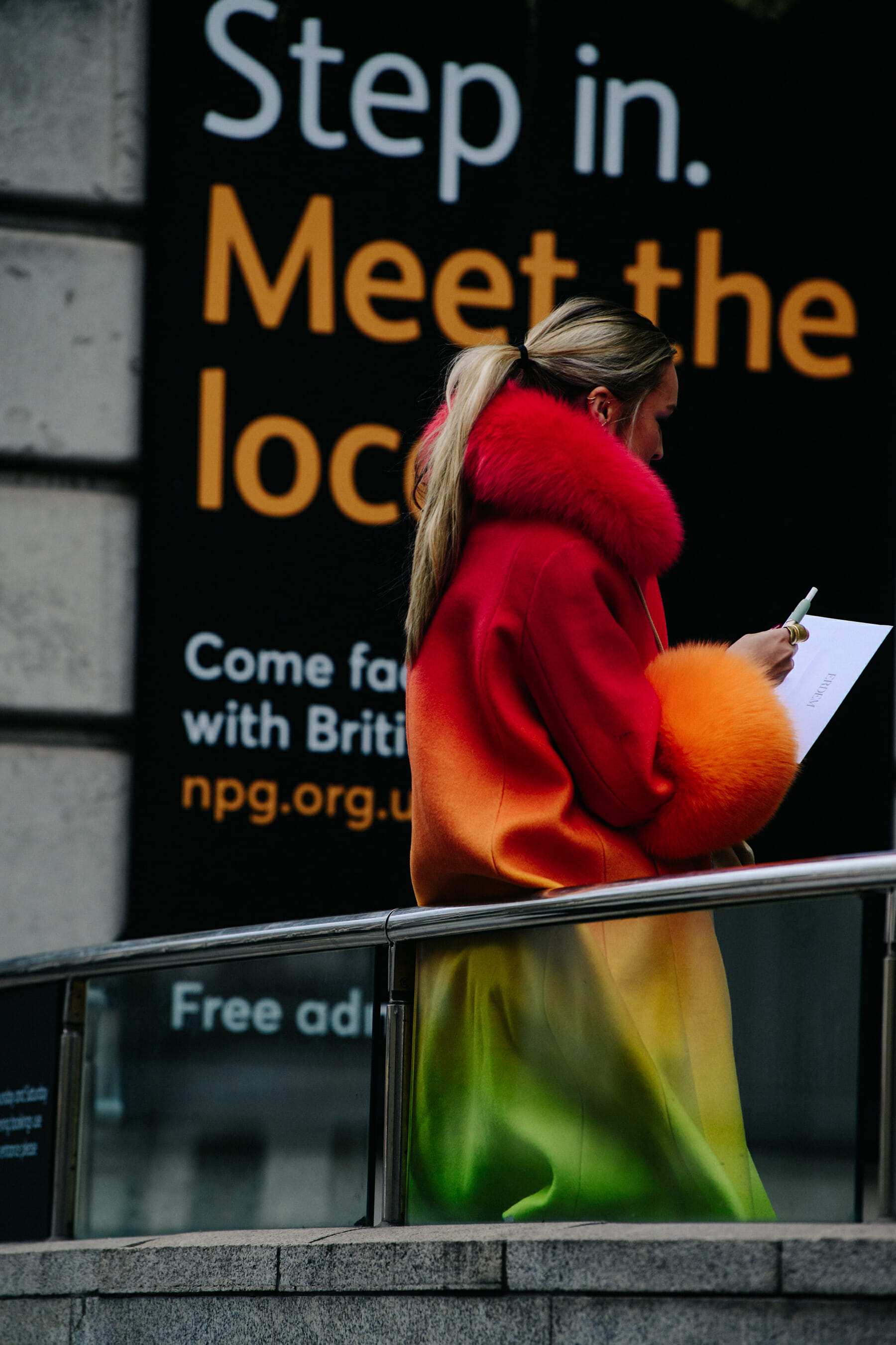 Woman wearing red graident coat