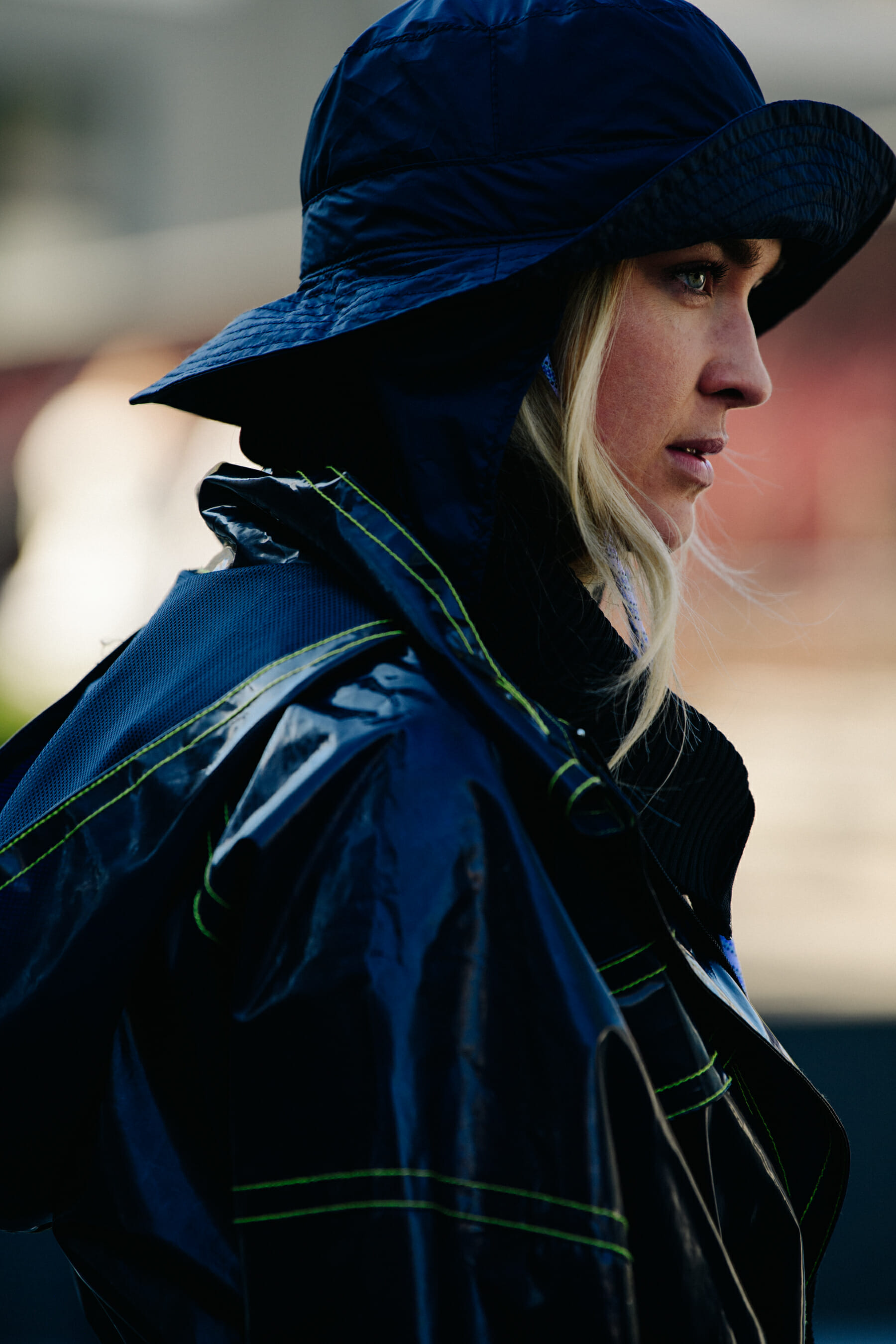 Woman wearing black rain hat
