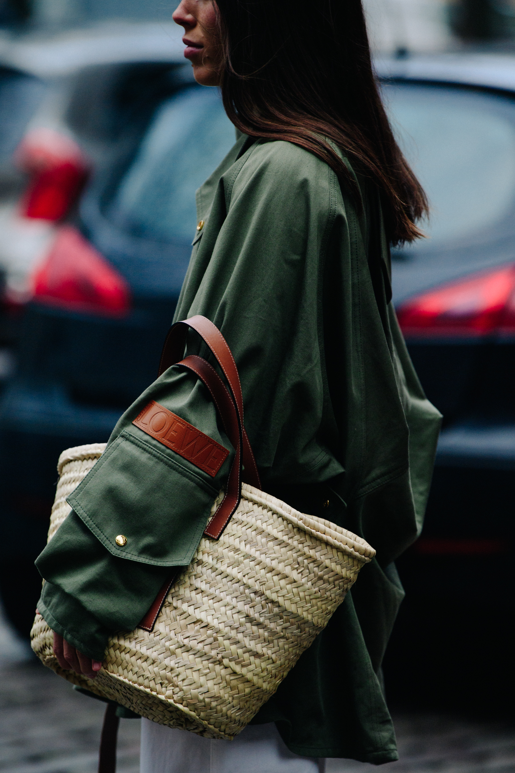 Woman wearing green Loewe jacket