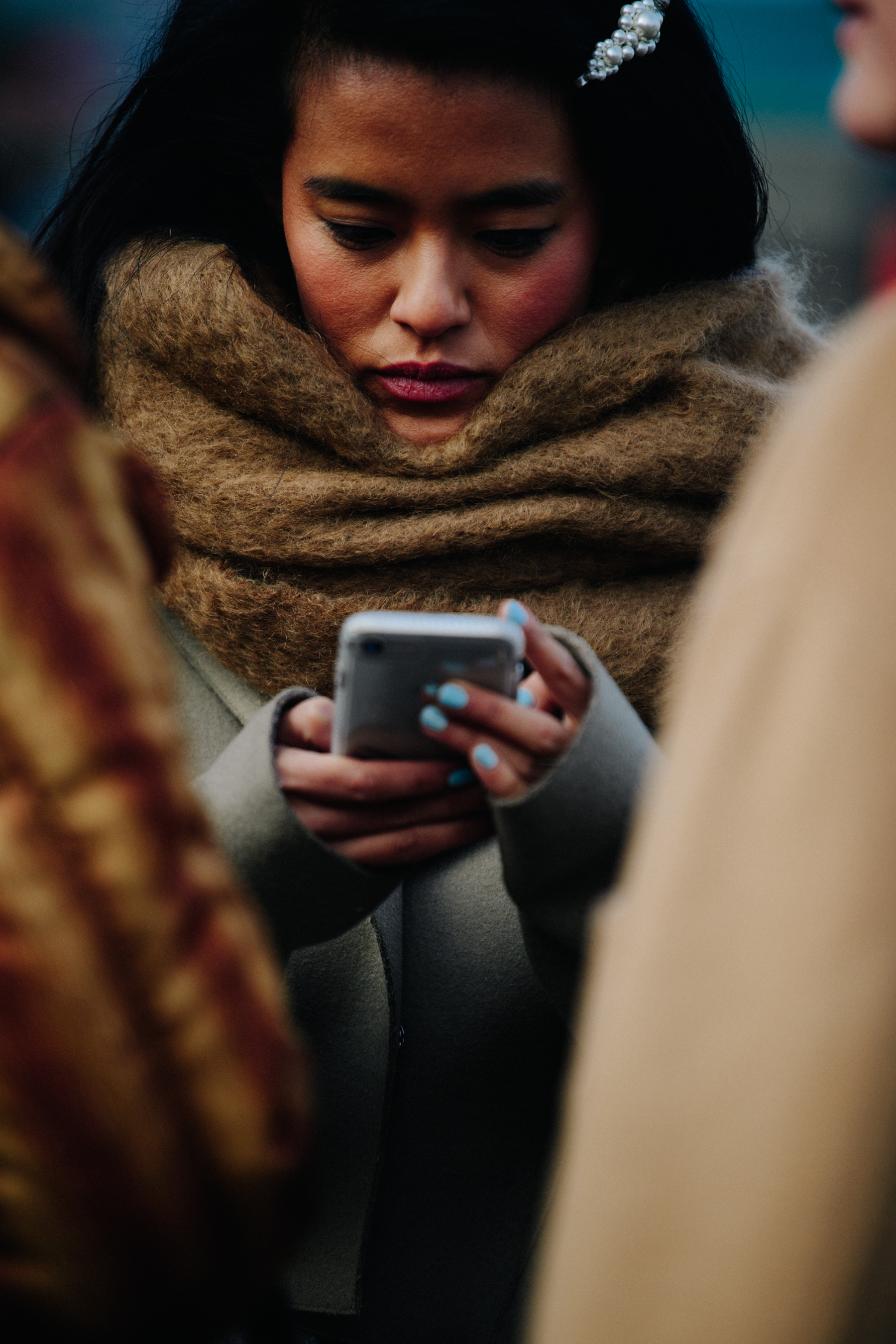 Woman wearing thick brown scarf