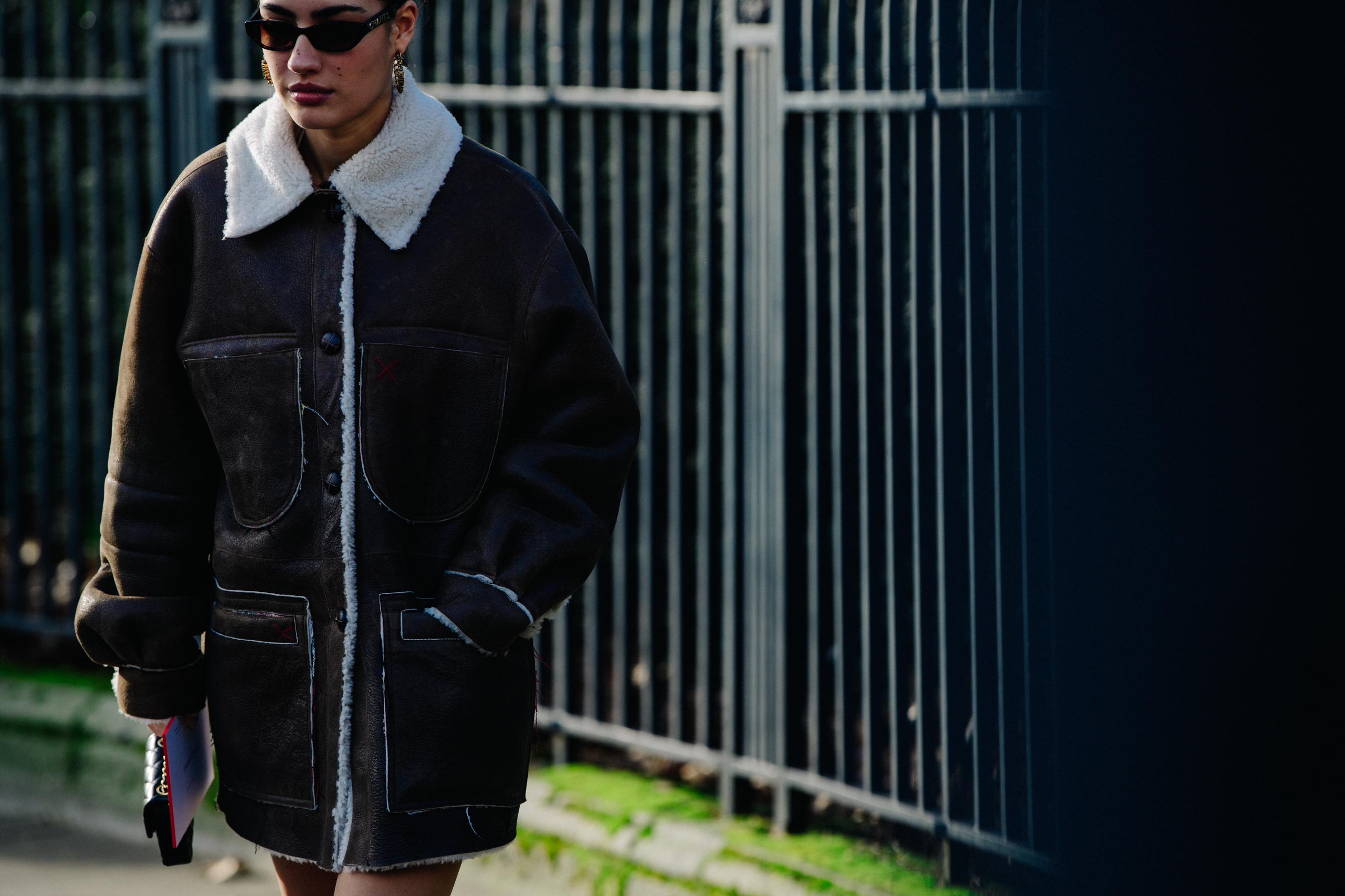 Woman wearing brown leather coat