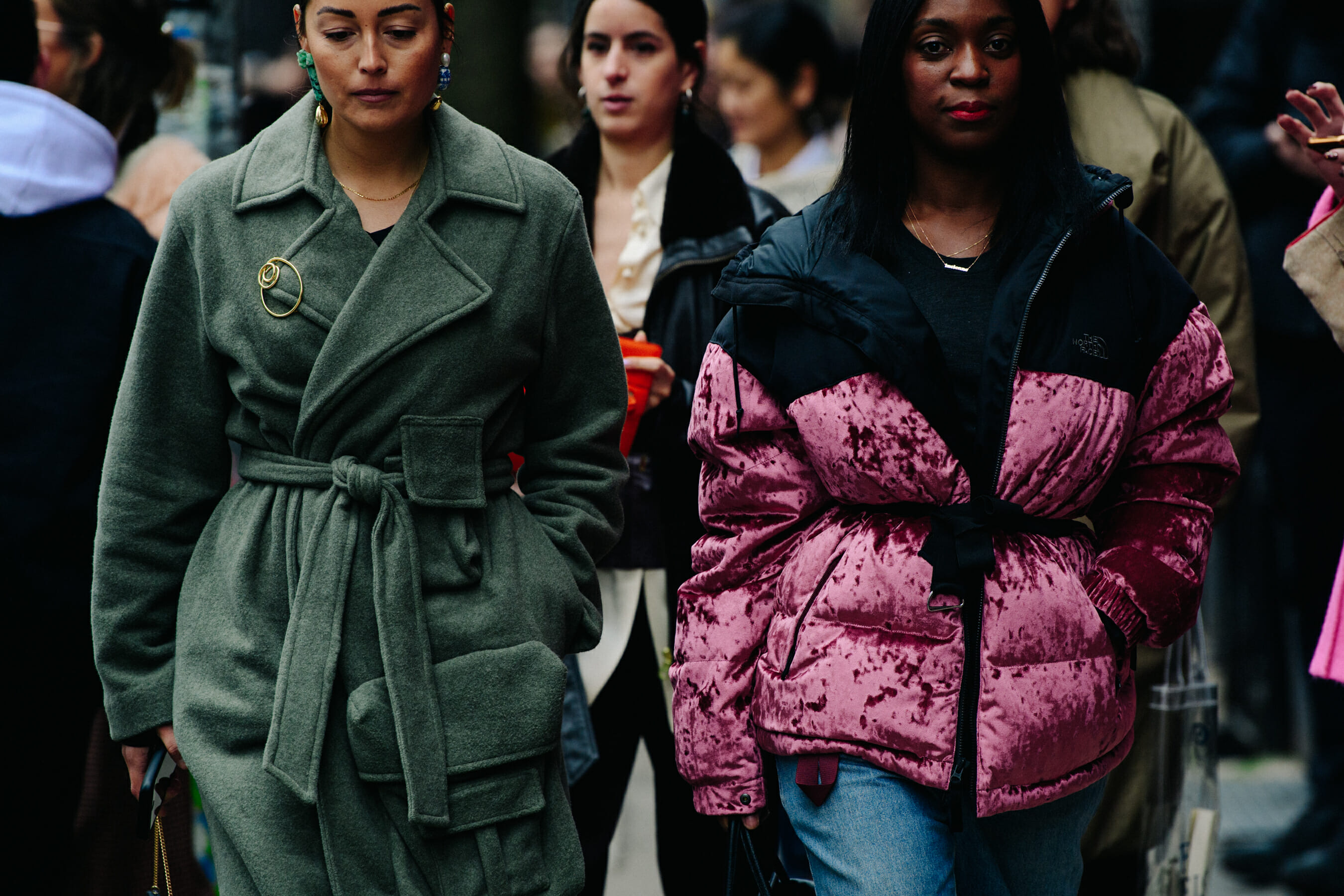 Two women wearing winter coats