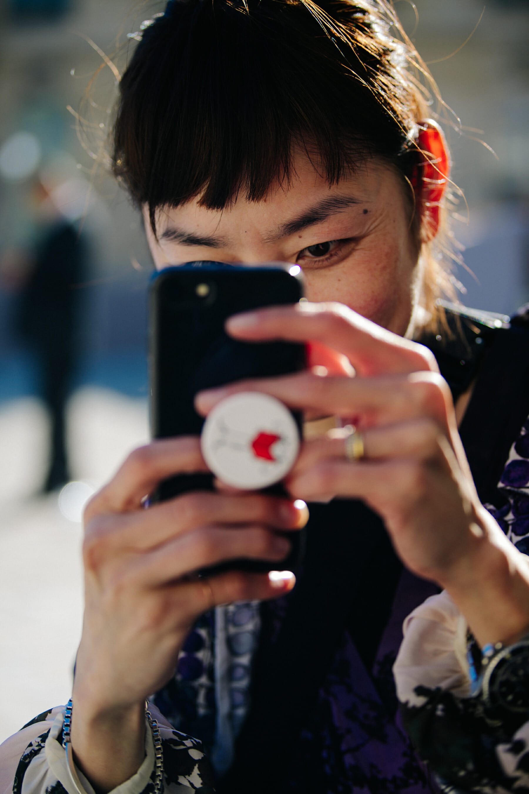 Woman taking picture with iphone