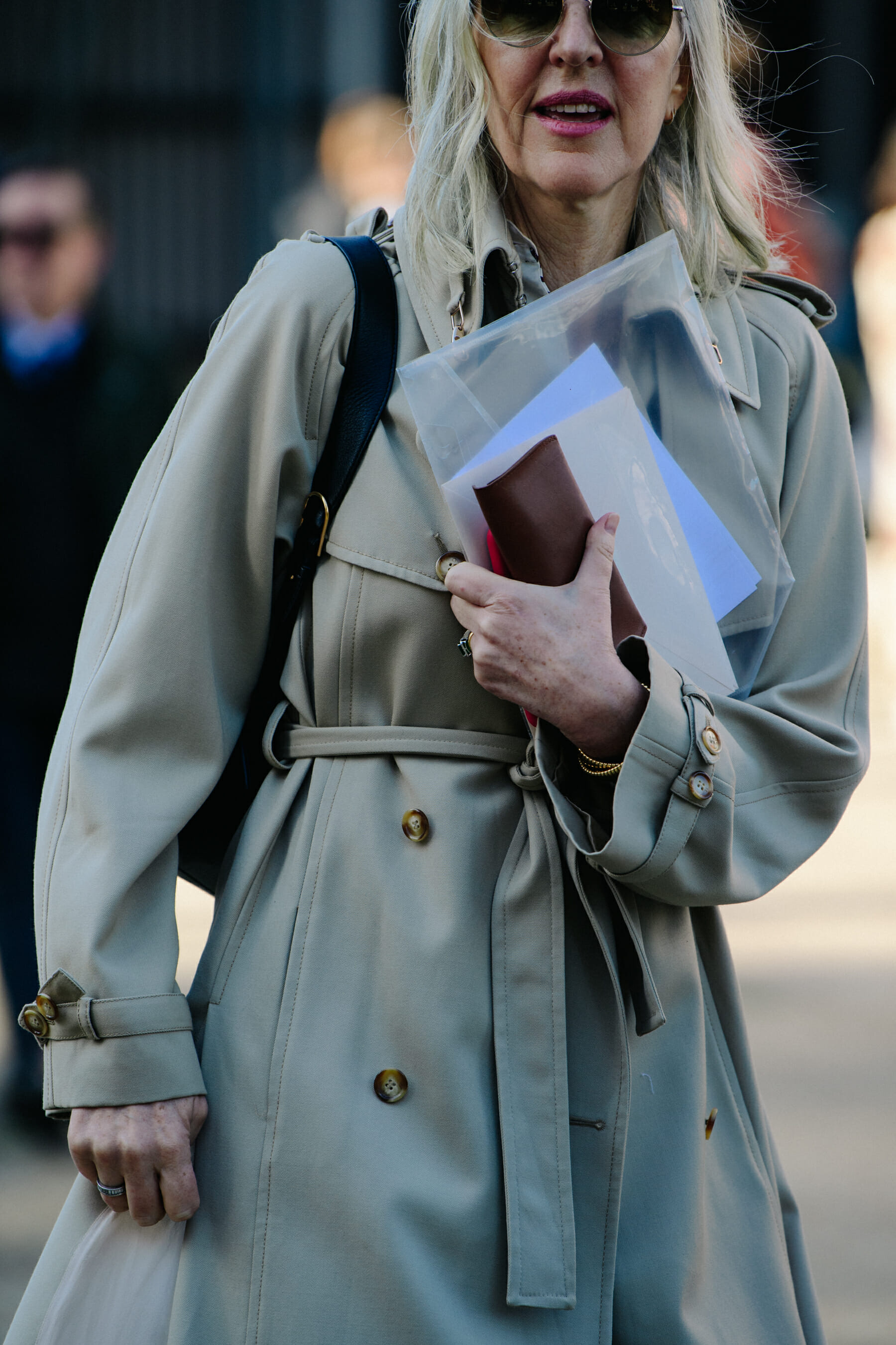 Woman wearing pale coat