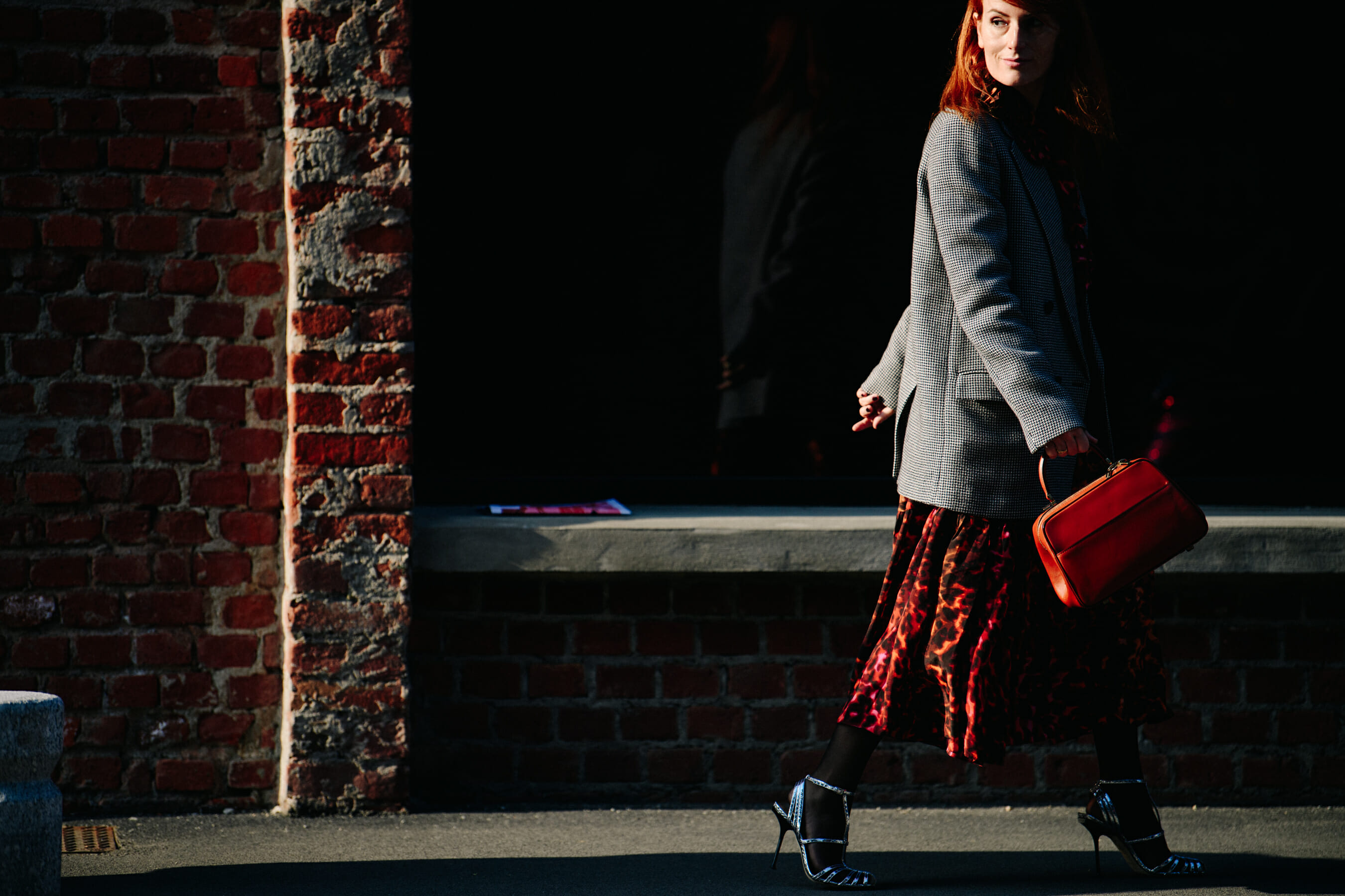 Woman carrying red bag