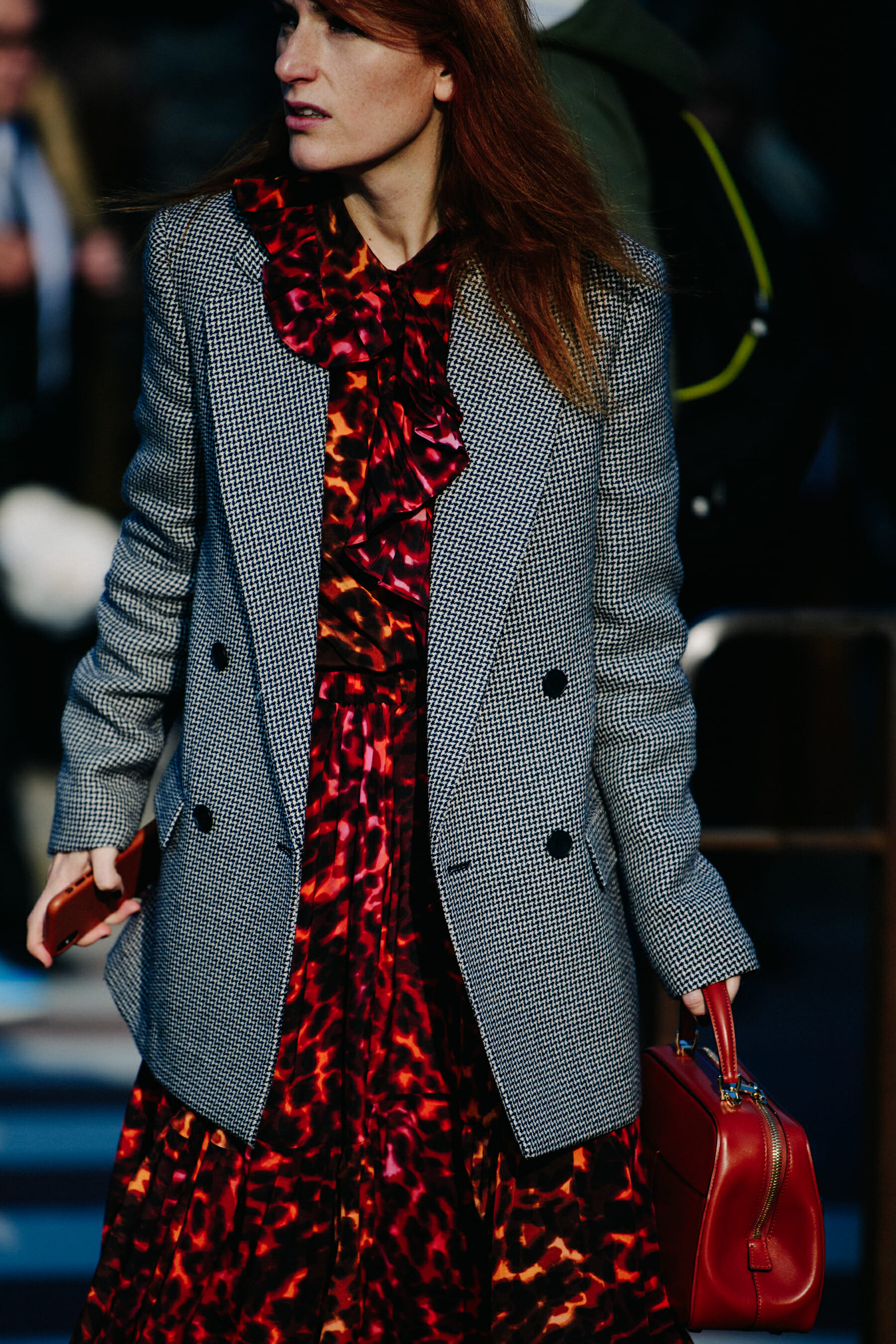 Woman carrying red bag