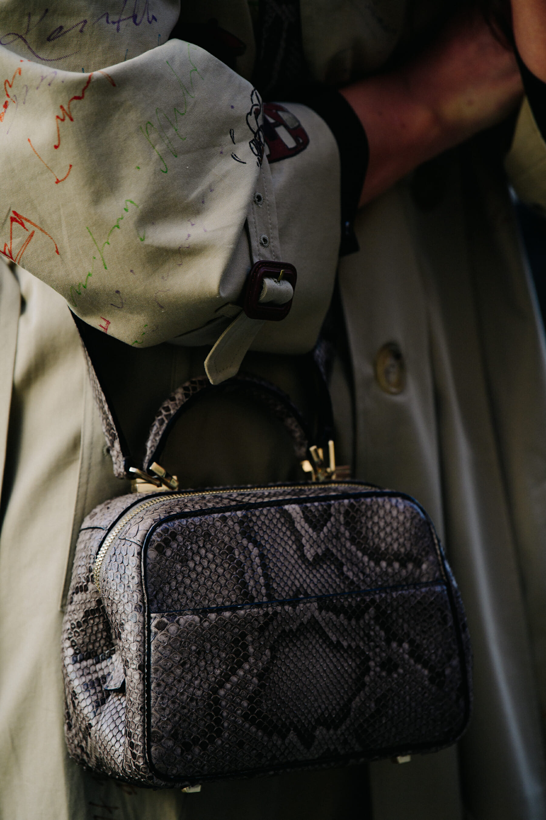 Woman carrying snakeskin bag