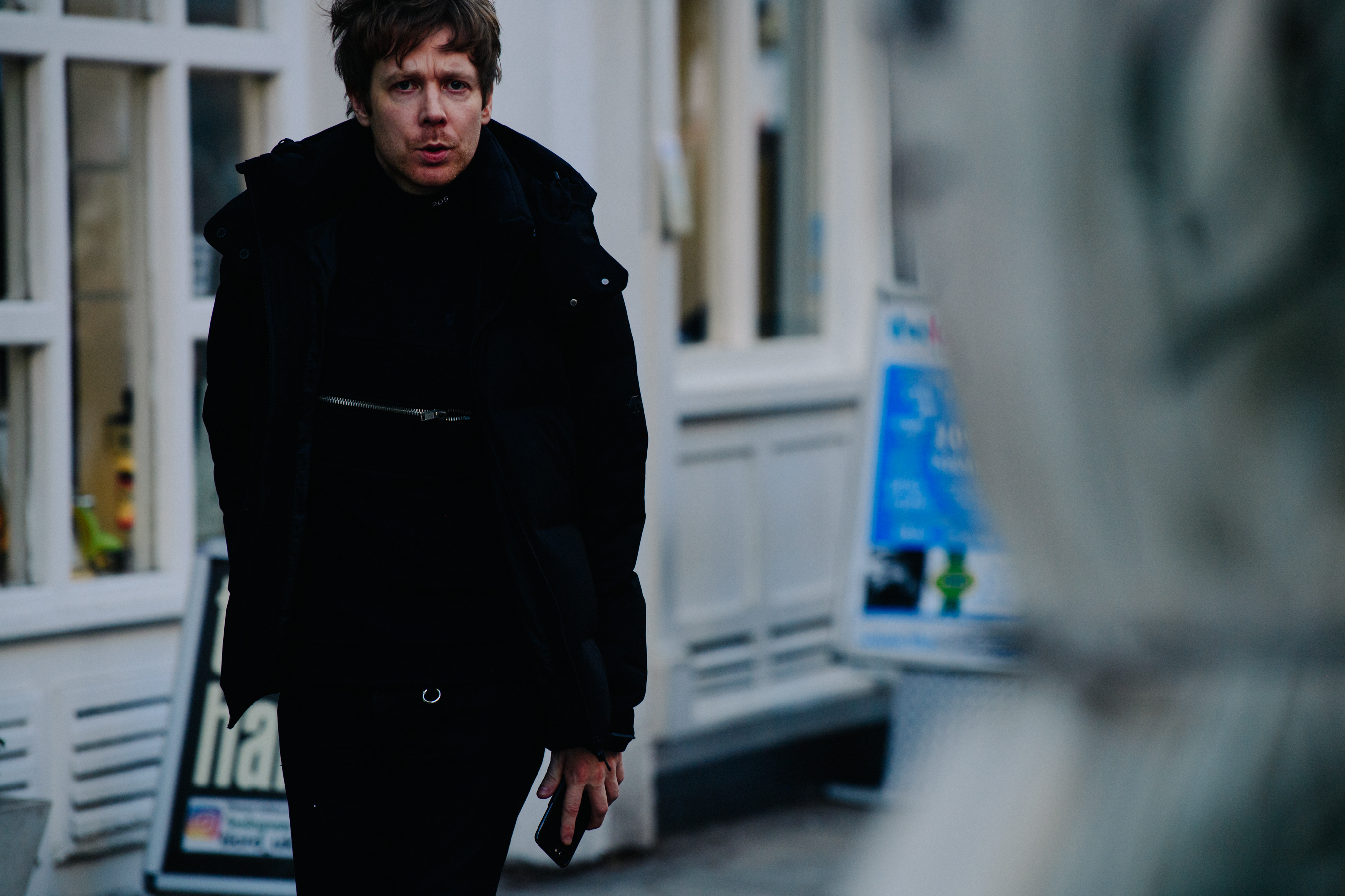 Man wearing black coat