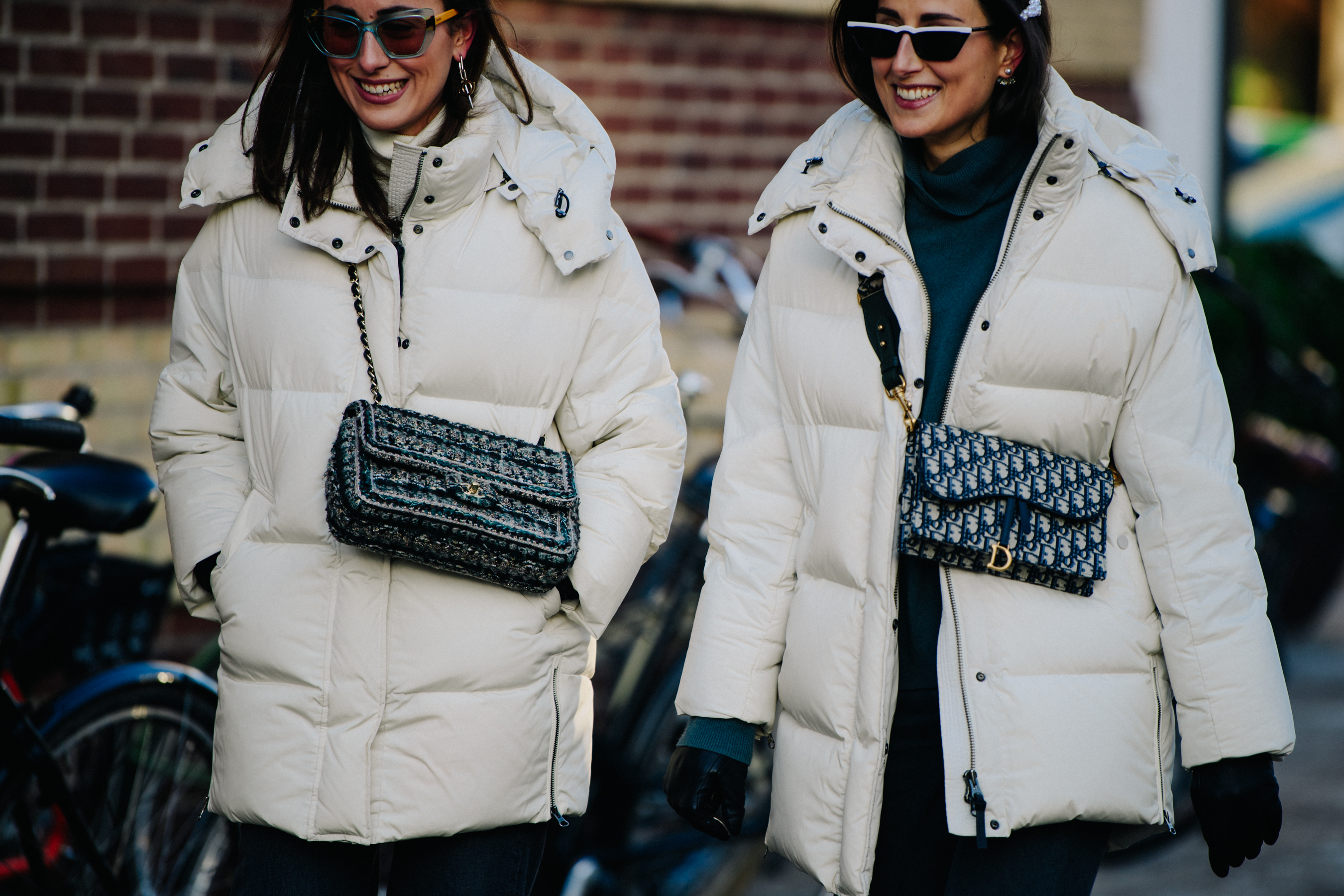 Two women wearing white coats