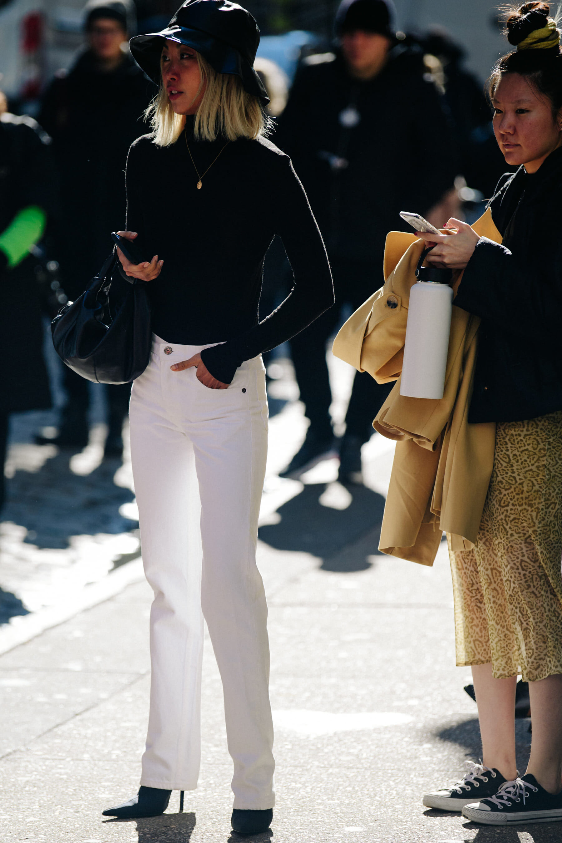 Asian woman wearing white jeans