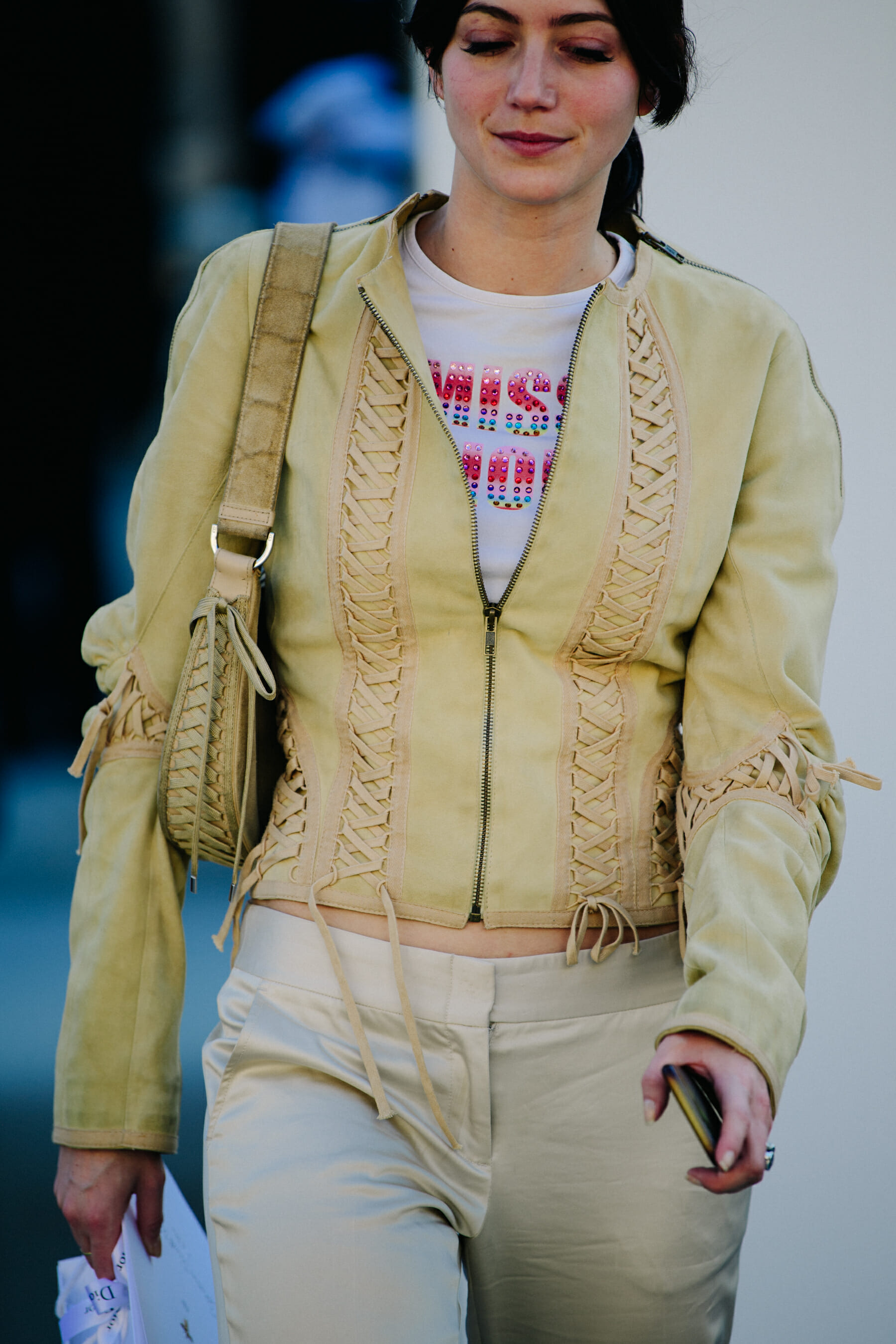 Woman wearing yellow leather jacket