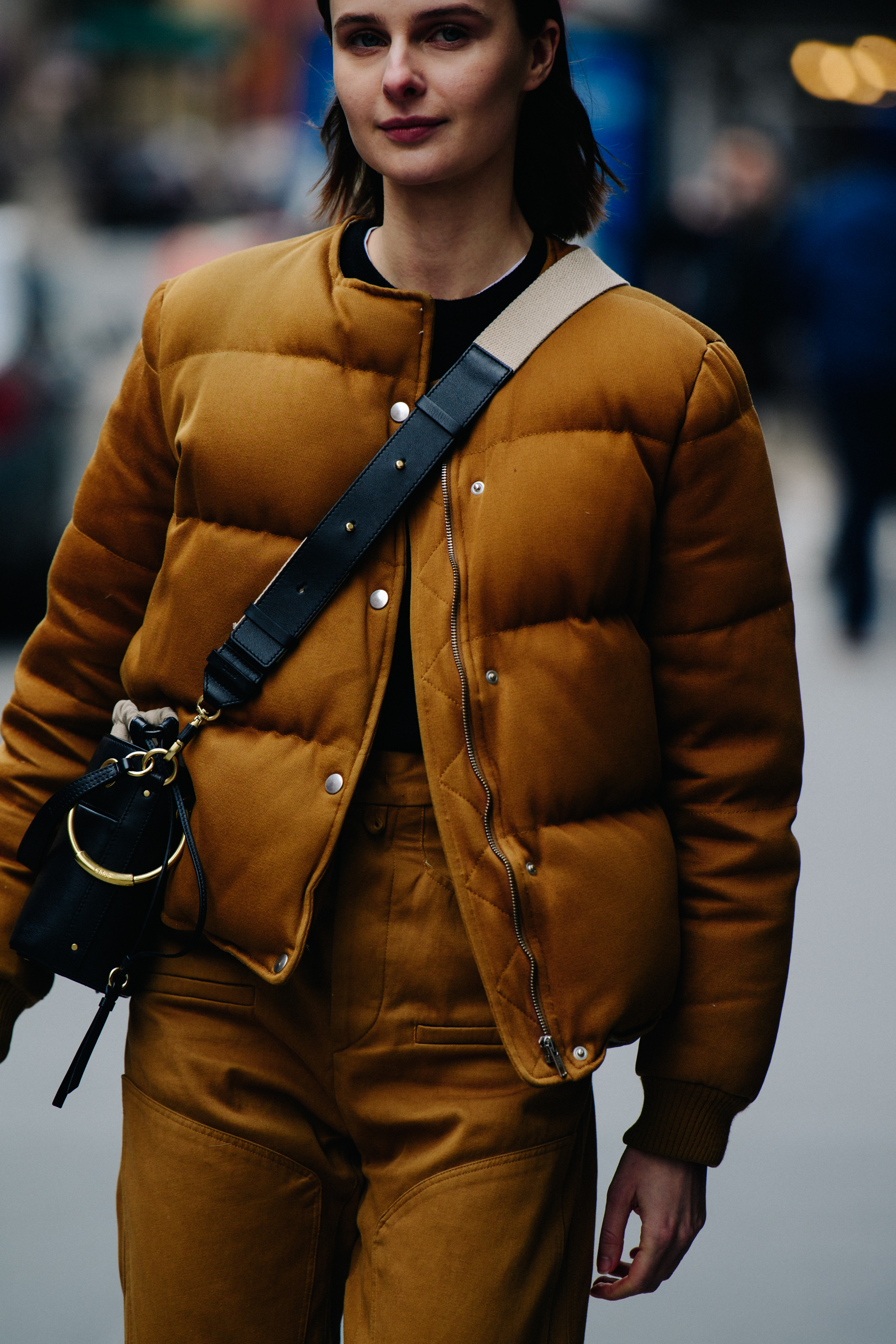 Model wearing brown outfit