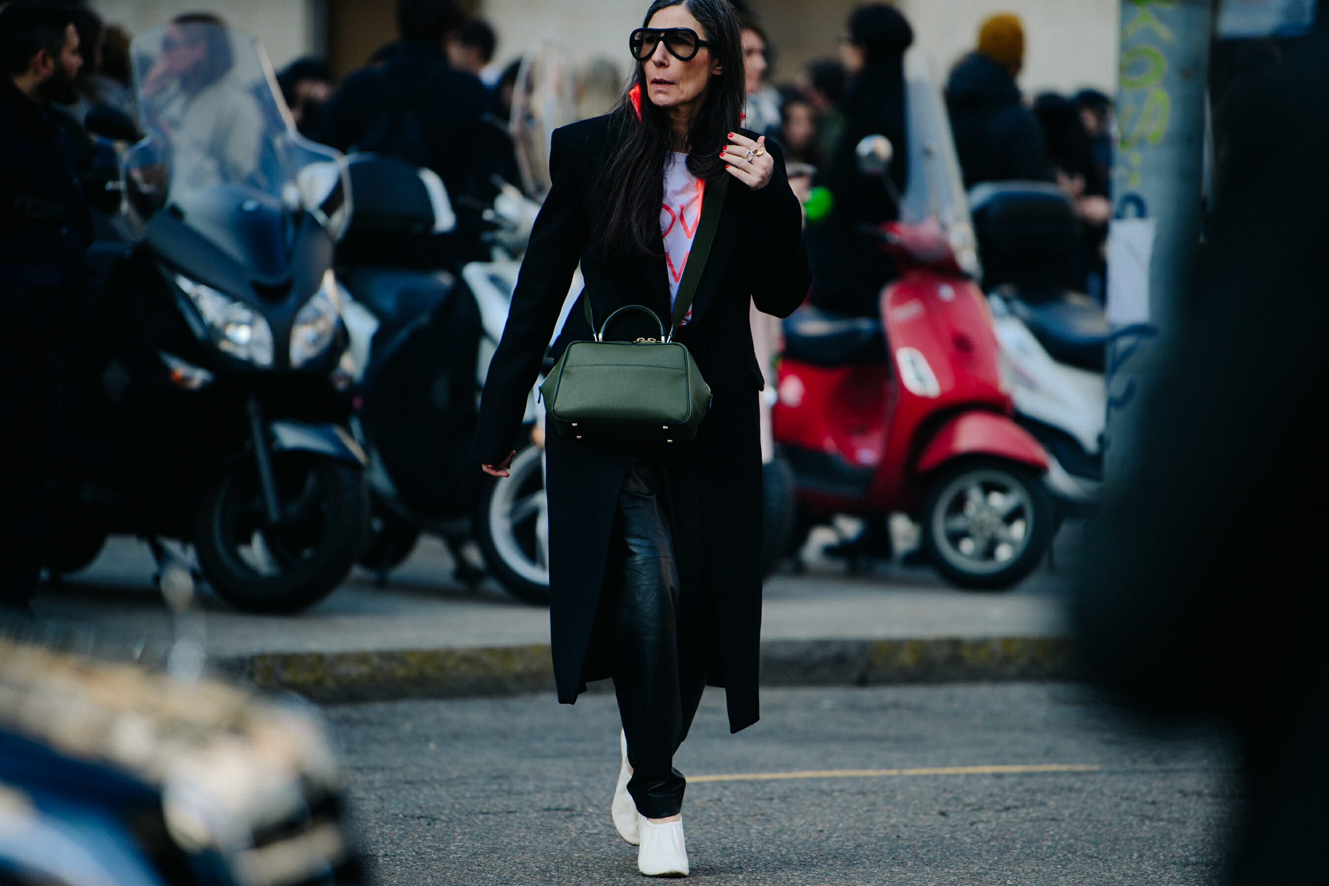 Woman wearing large black glasses