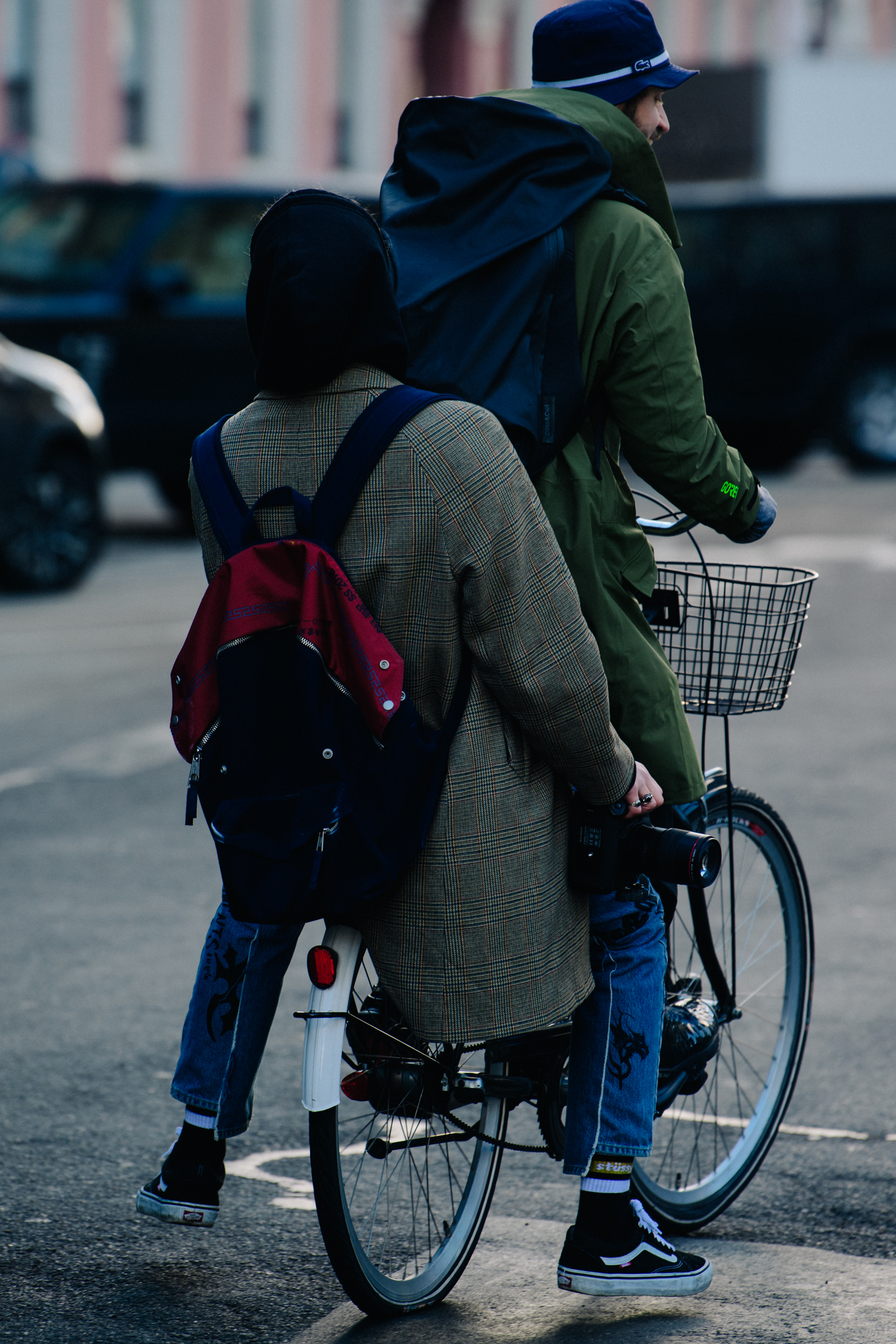 Two men riding a bicycle