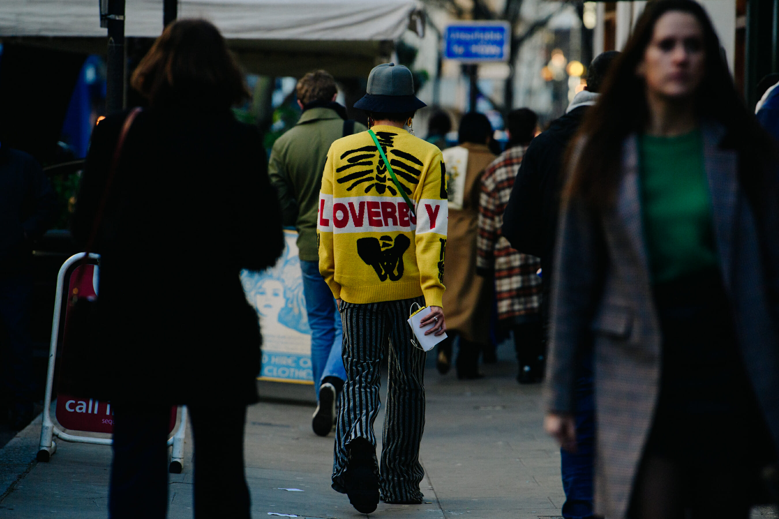 Japanese man wearing yellow jumper