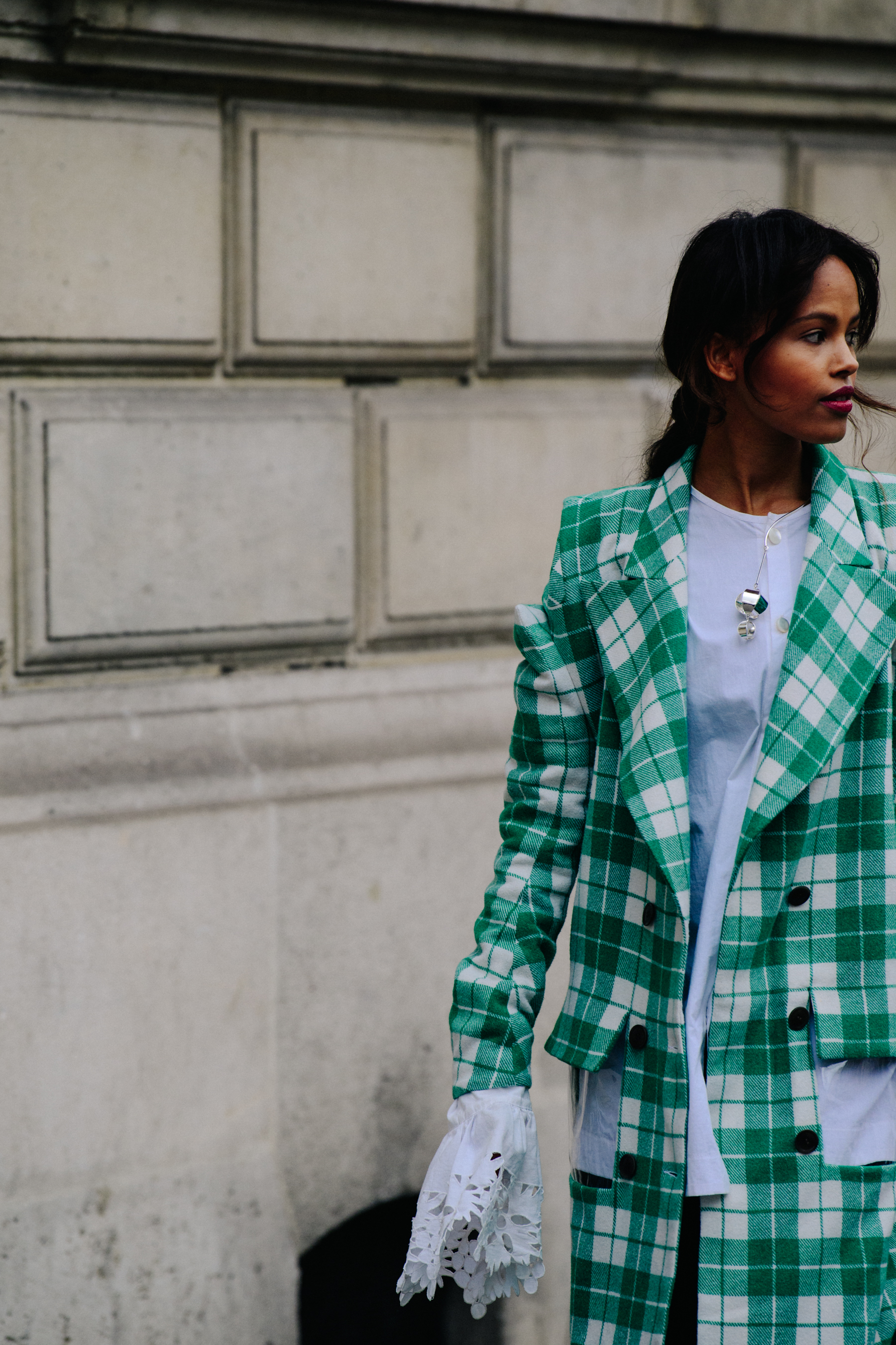 Woman wearing green check coat