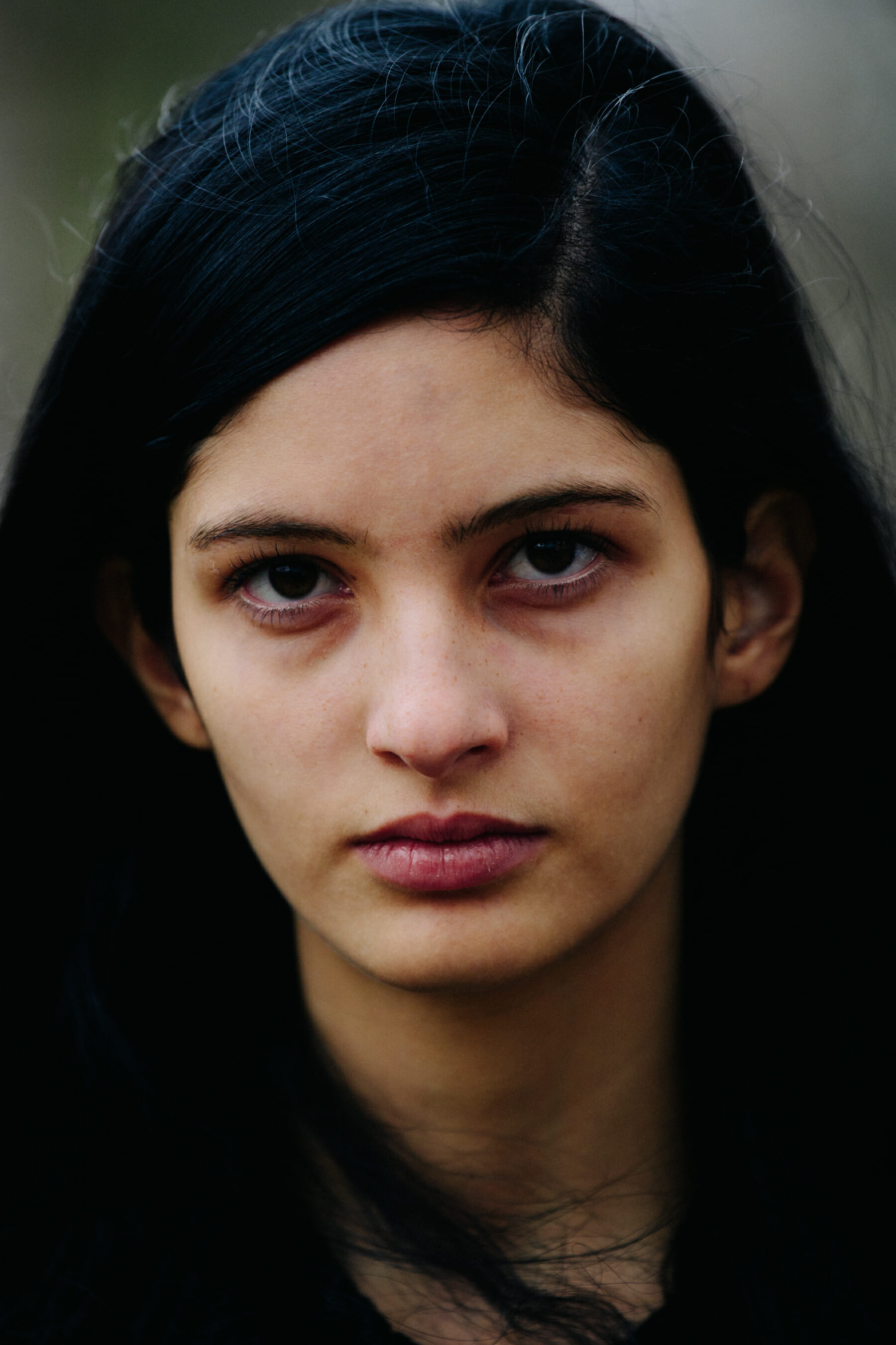Portrait of model with thick dark hair