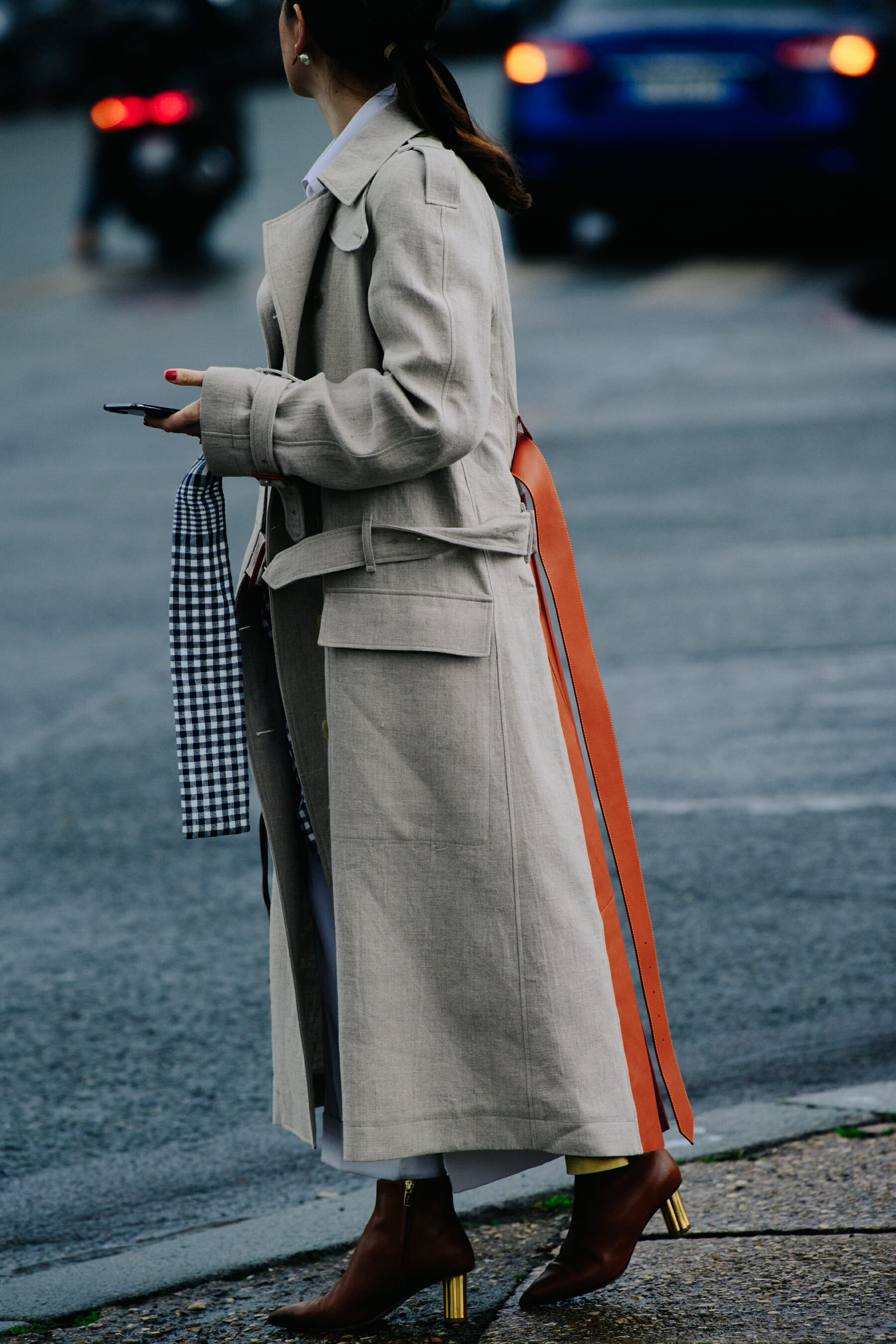 Woman wearing grey trench coat