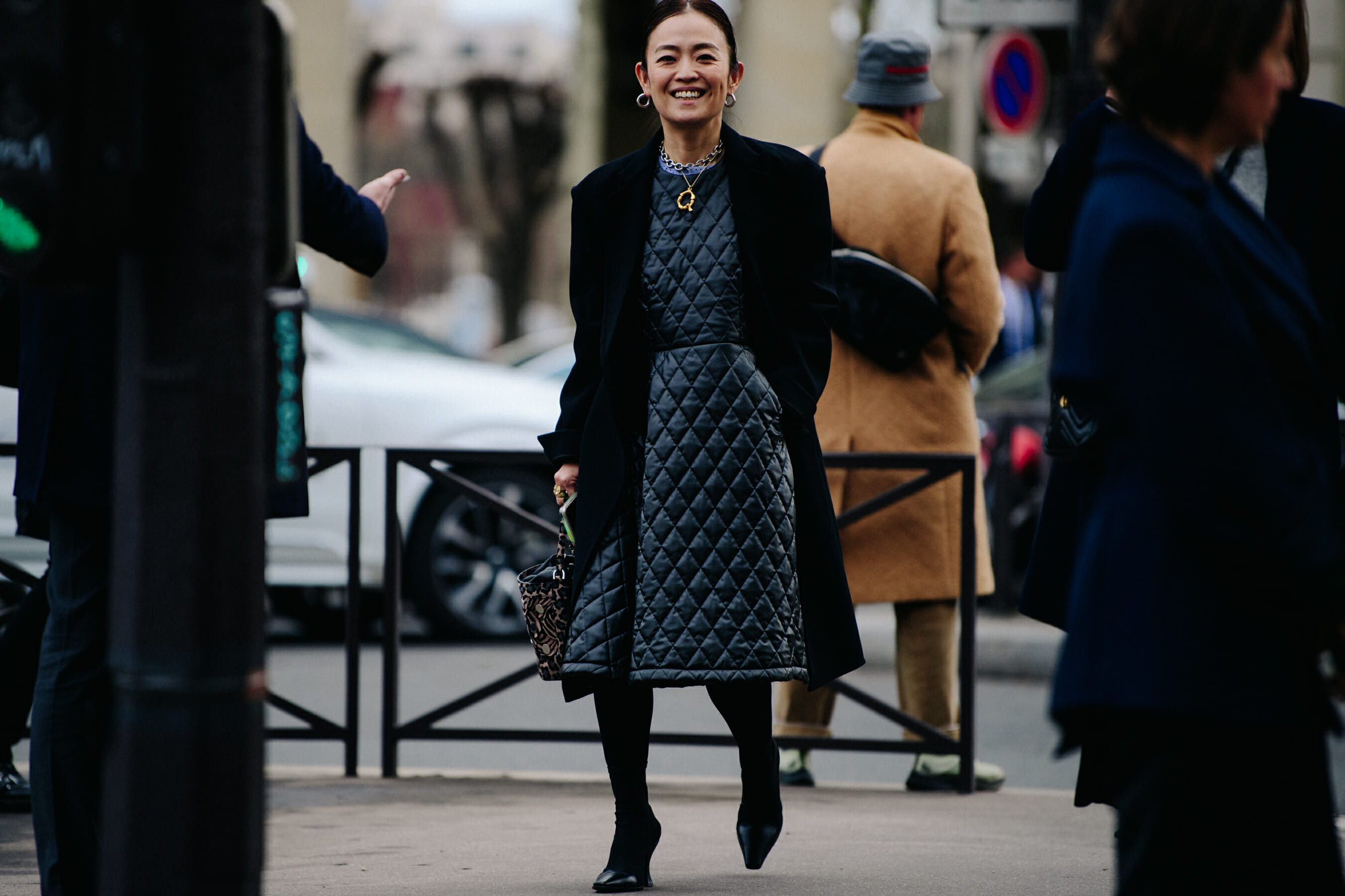 Woman wearing long black coat