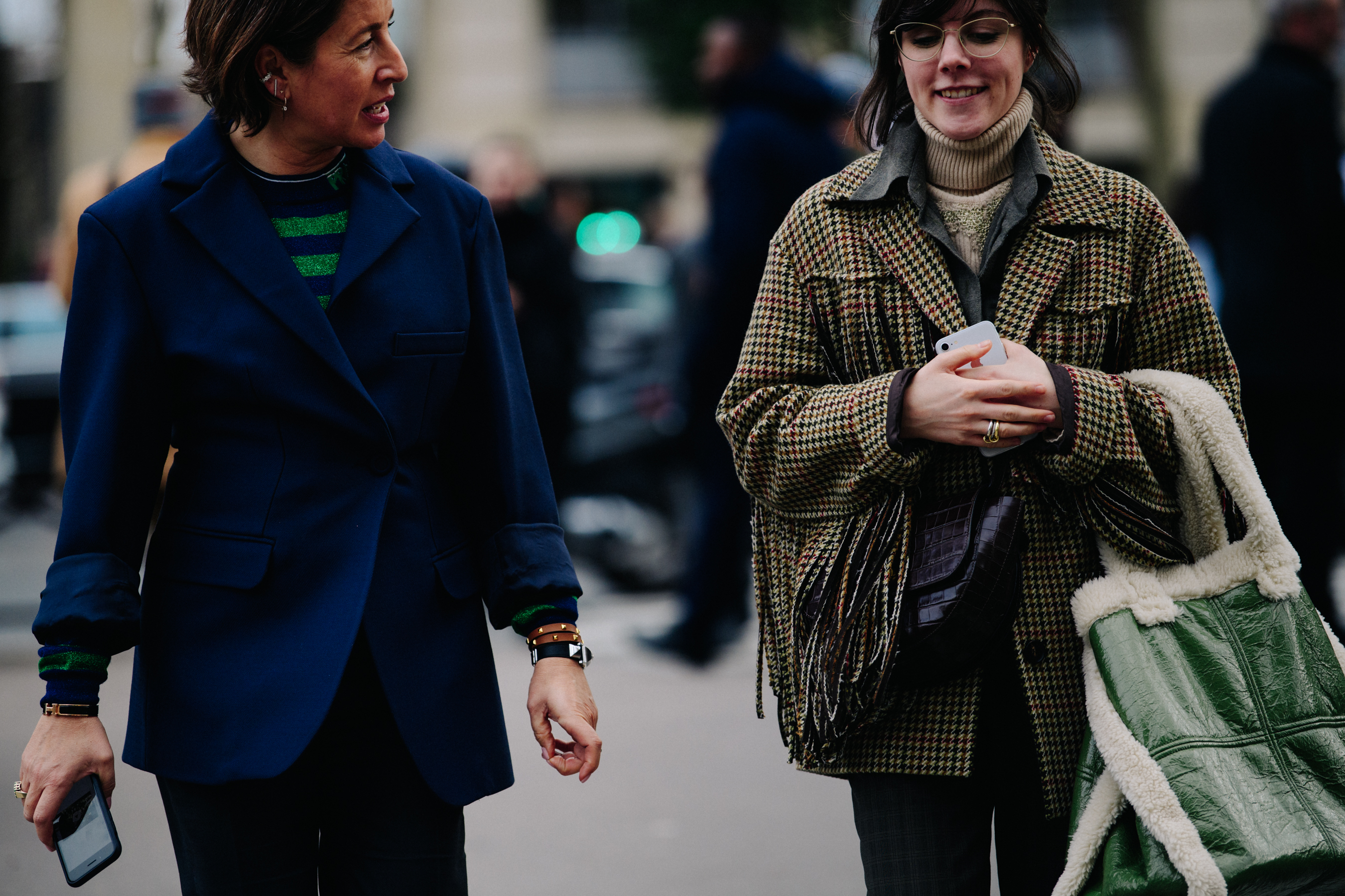 Two women wearing smart jackets