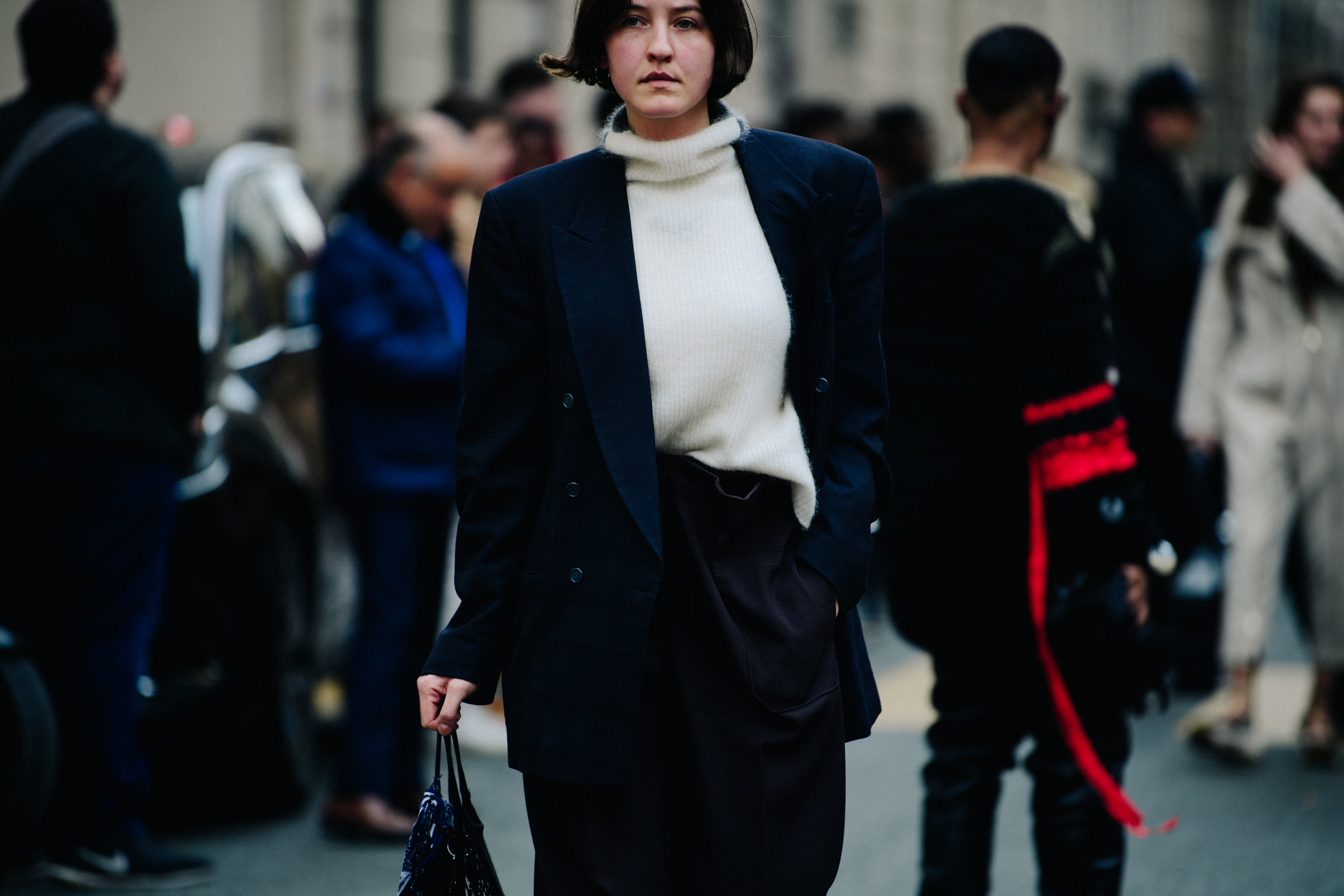 Woman wearing white wool jumper