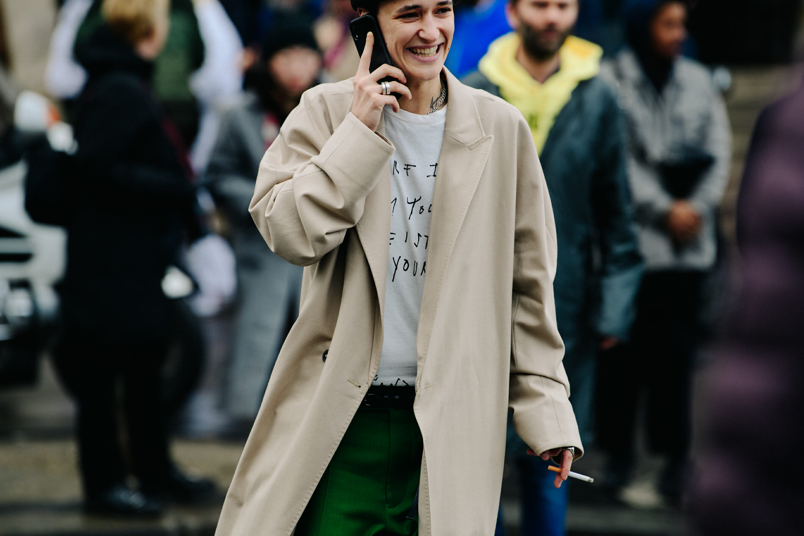Woman wearing long tan coat