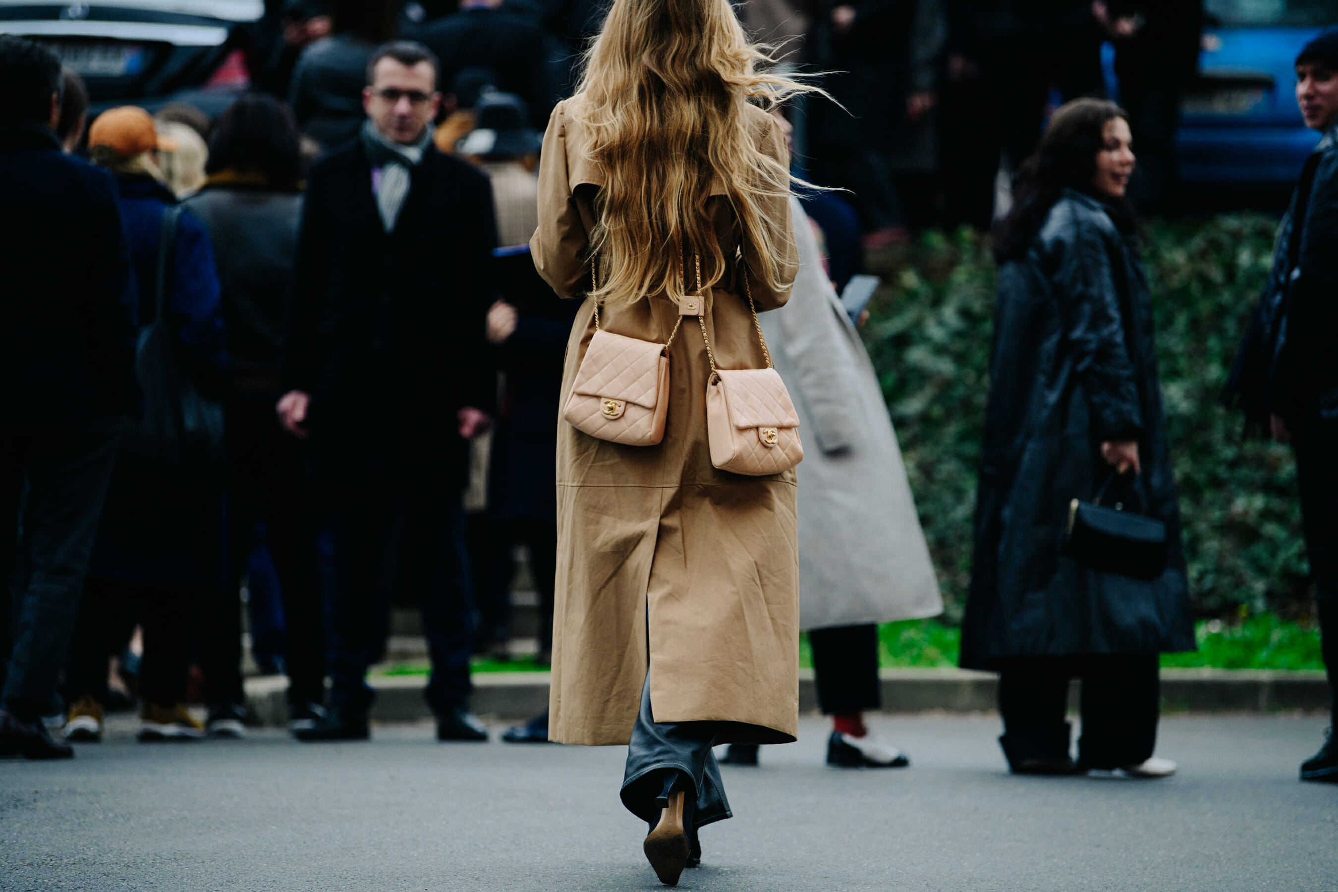 Woman wearing two Chanel bags
